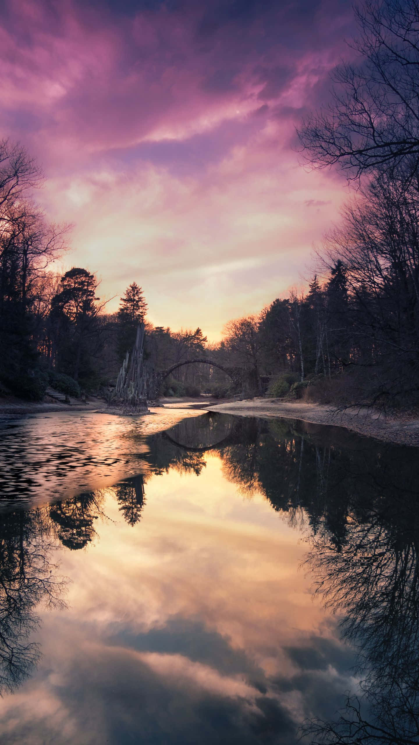 river, vibrant purple and orange sunset sky, bare winter trees, 2K Phone Wallpaper