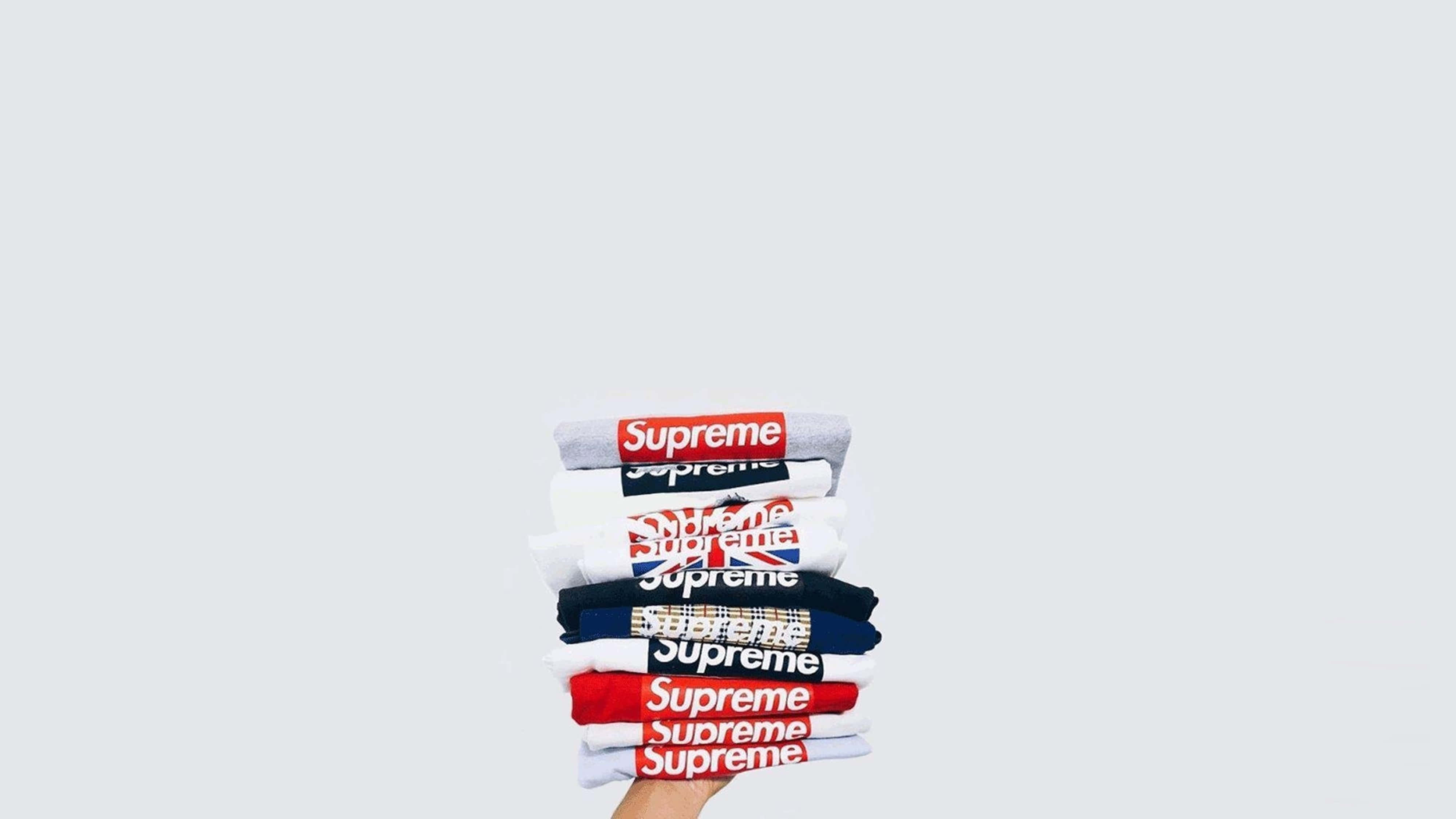 Supreme, folded t-shirts, light gray background, 4K Desktop Wallpaper