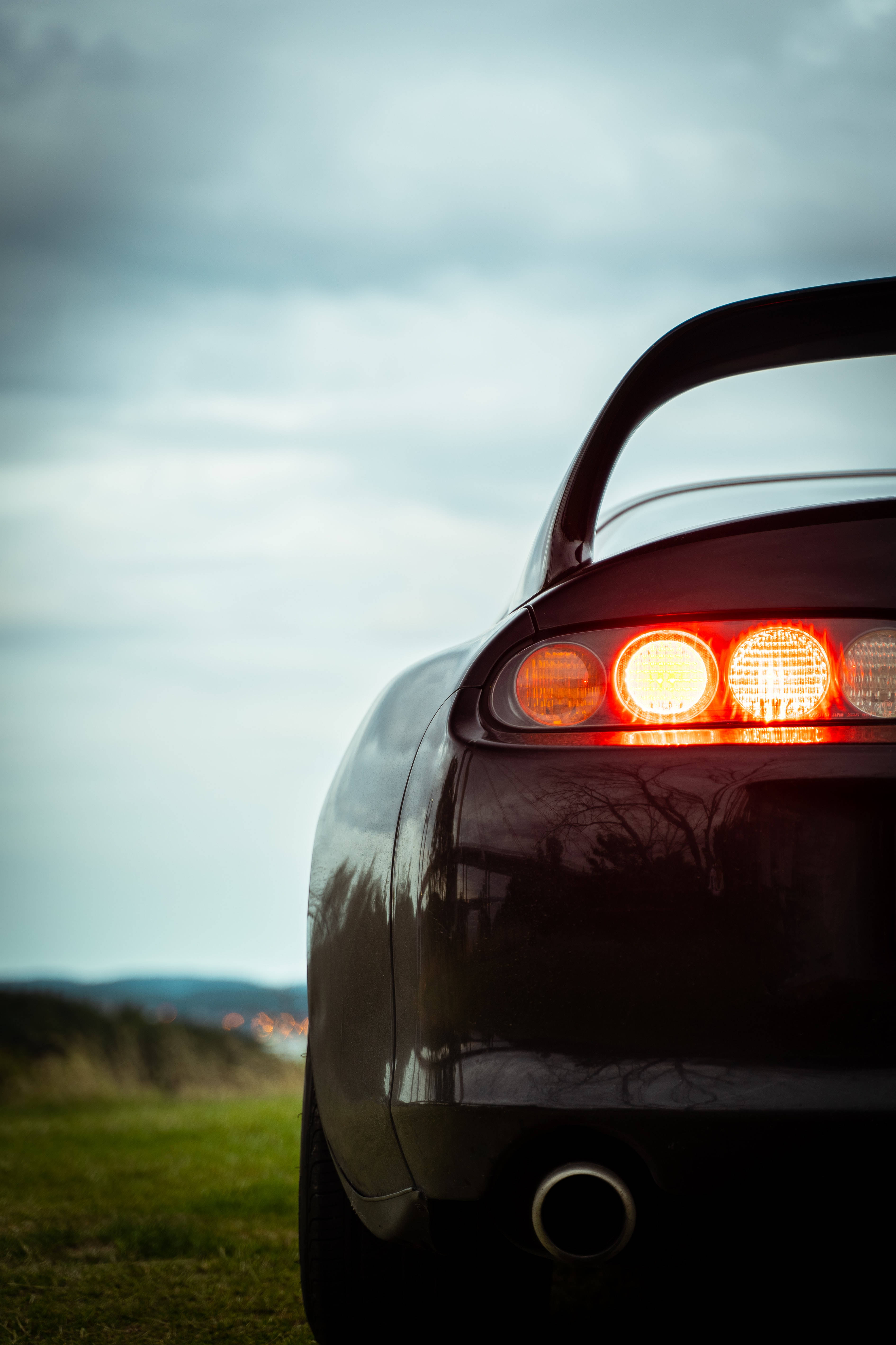 4K Toyota Supra, black, glowing red taillights, 5K Phone Wallpaper
