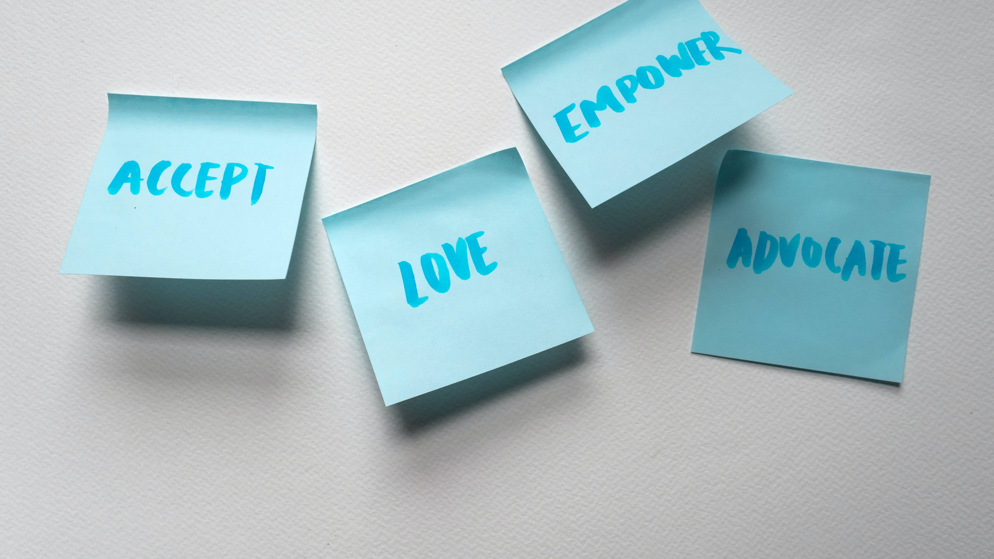 light blue sticky notes, handwritten words accept love empower advocate, textured white surface, 4K Desktop Wallpaper