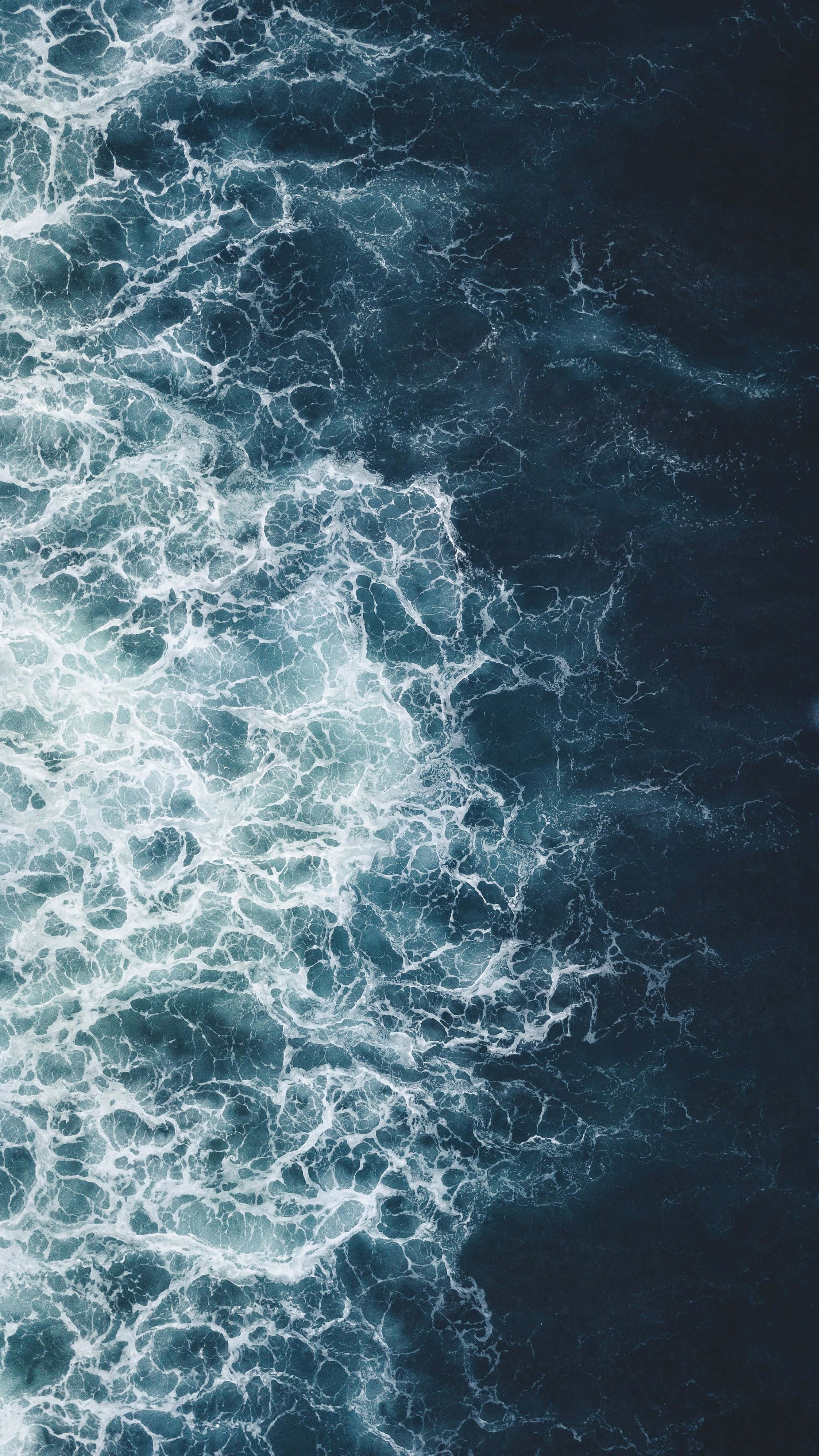 aerial ocean waves, turbulent ocean waves, intricate white foam patterns, 4K Phone Wallpaper