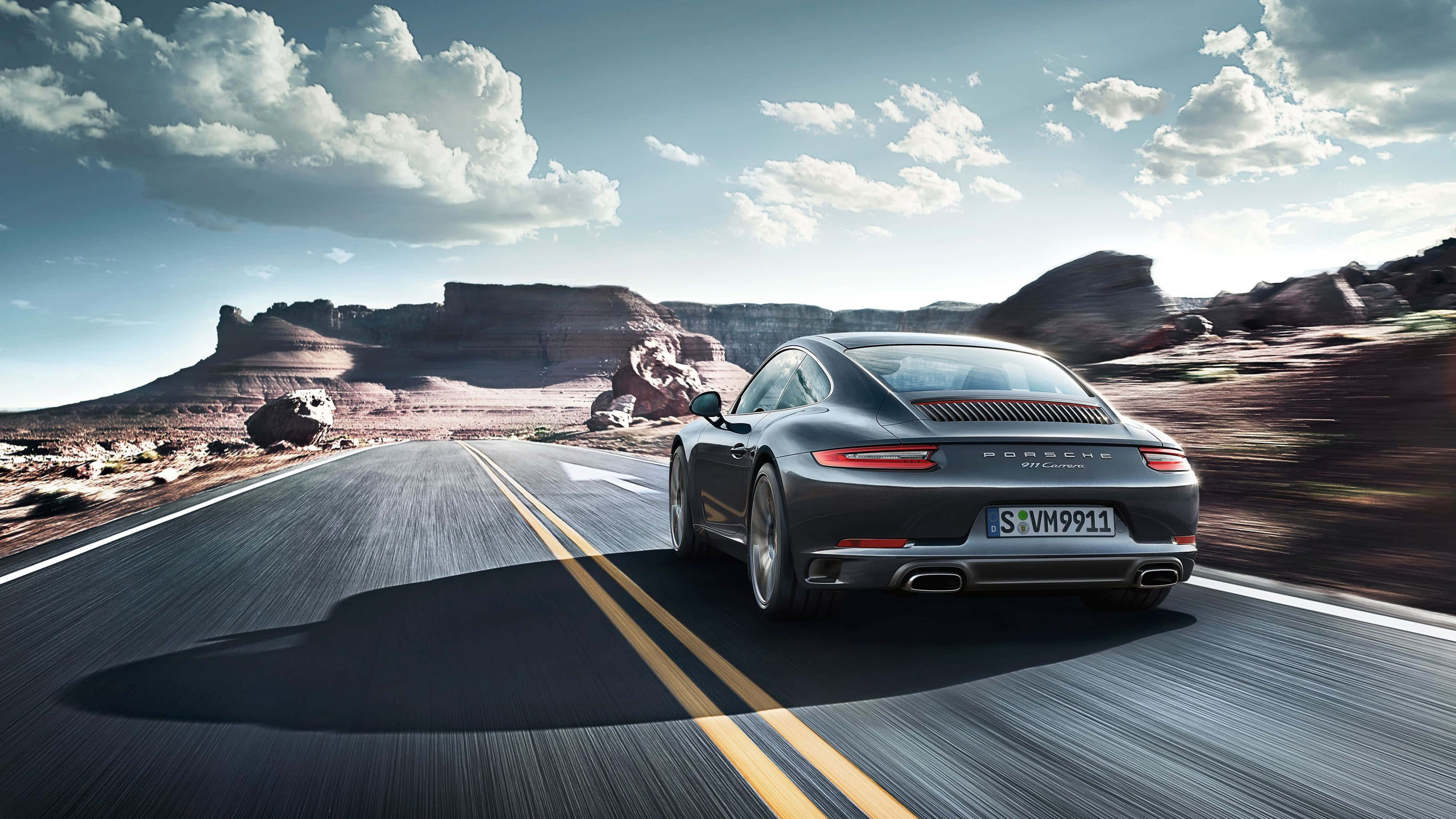 Porsche 911, sleek gray, desert highway, 4K Desktop Wallpaper