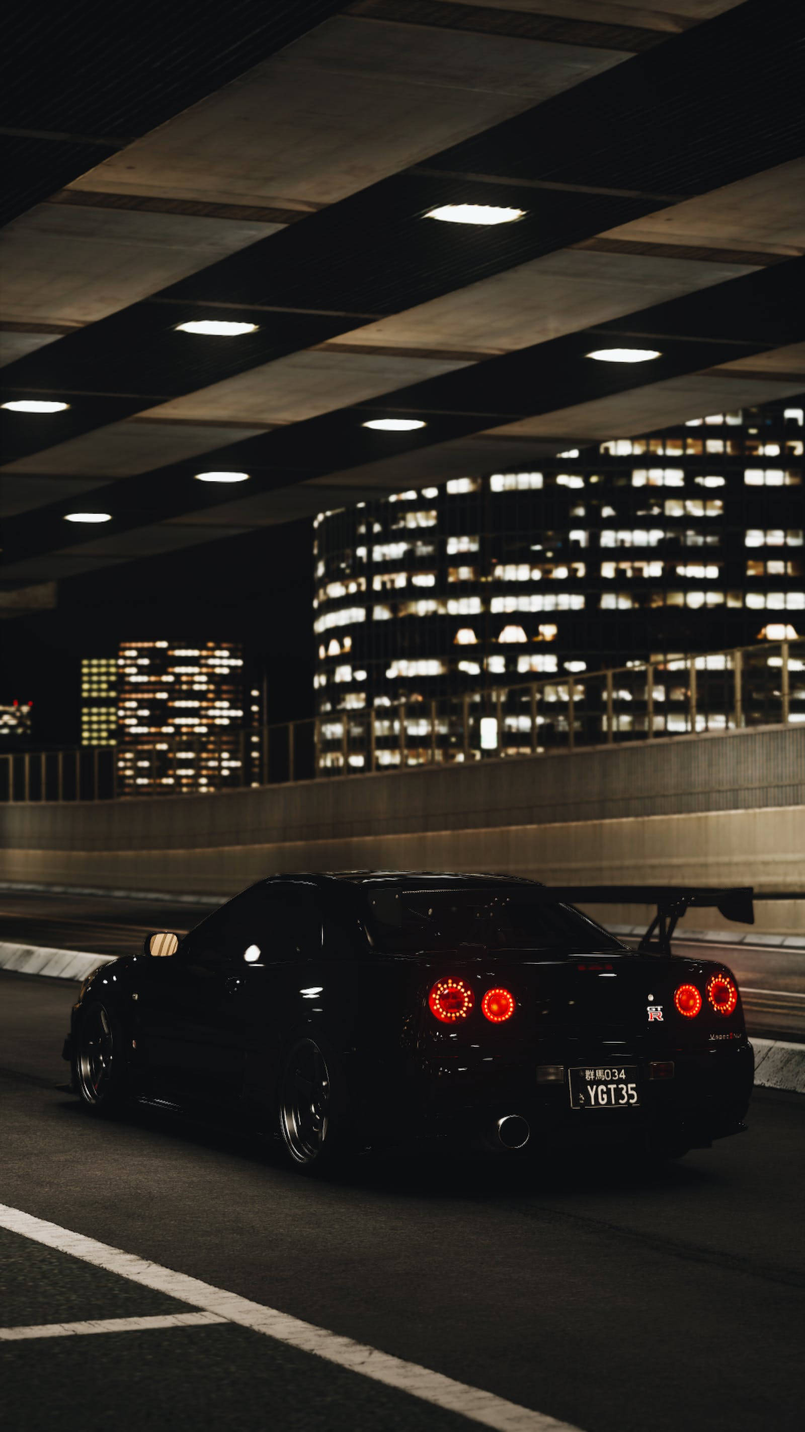 black Nissan GT R, glowing red taillights, lit urban overpass, 2K Phone Wallpaper