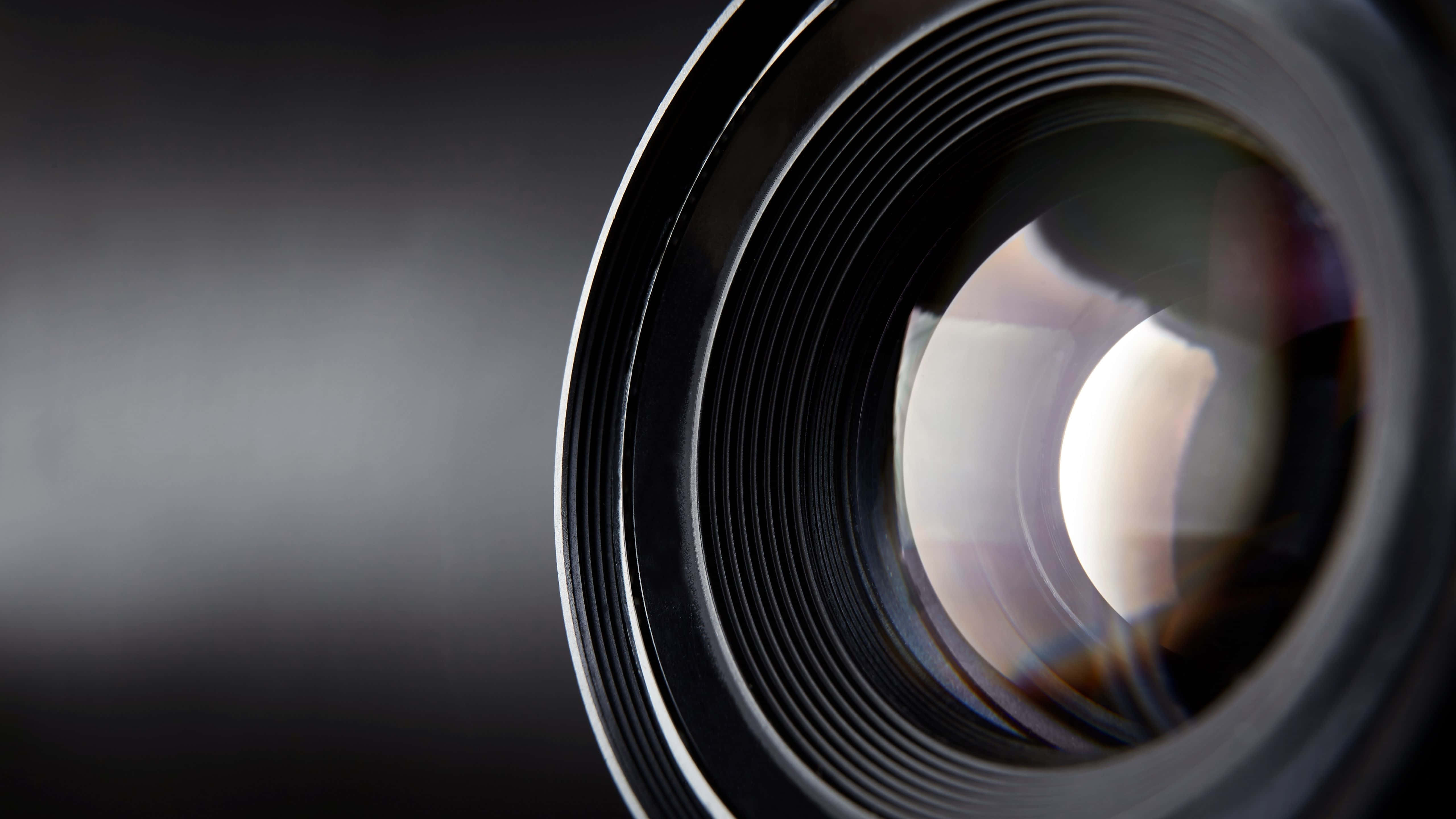 5120x2880, sleek black camera lens, metallic ridges, 5K Desktop Wallpaper