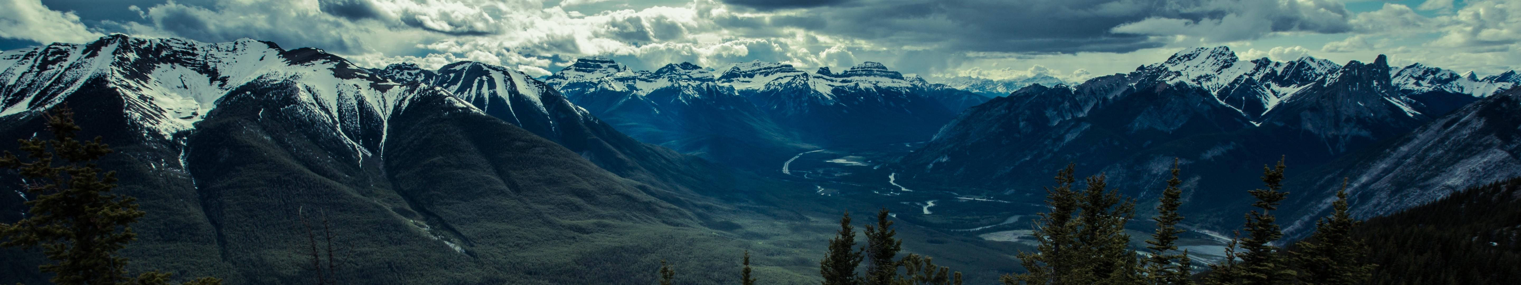 mountains landscape panorama, snow-capped mountains, dramatic cloudy sky, 5K Desktop Wallpaper