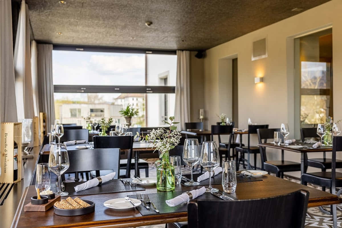 Aarau, elegant modern restaurant interior, dark wood tables, SD Desktop Wallpaper