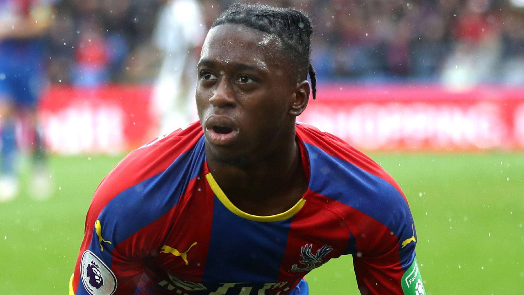 Aaron Wan-Bissaka, red and blue jersey, rainy stadium, Full HD Desktop Wallpaper