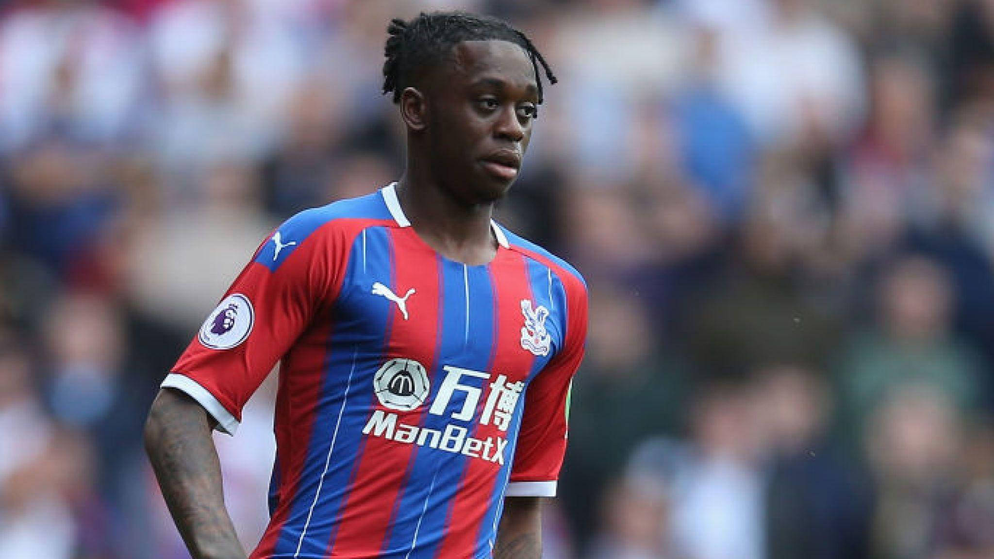 Aaron Wan-Bissaka, red and blue striped jersey, sunlit pitch, Full HD Desktop Wallpaper