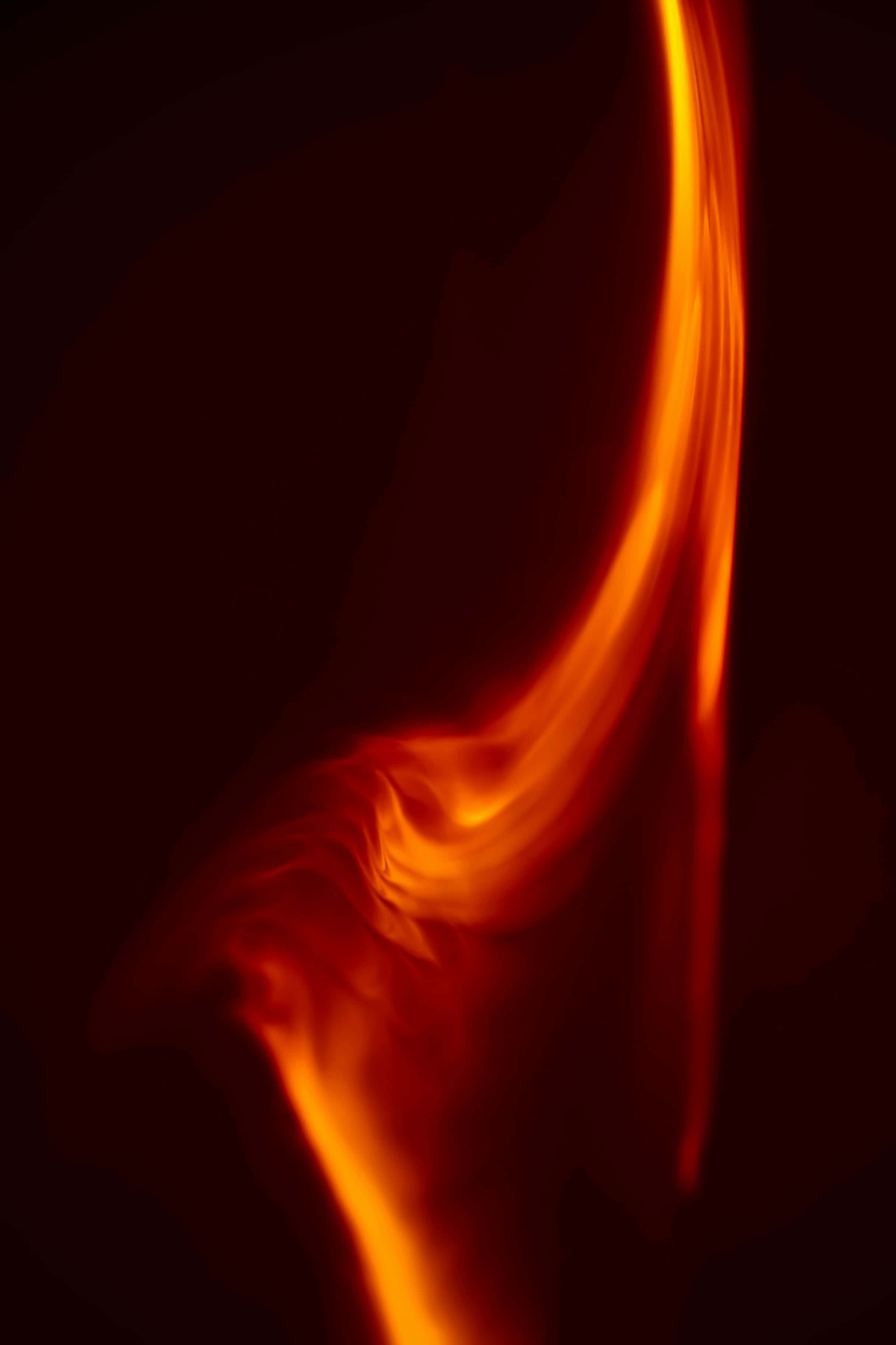 abstract flame curvature, vibrant orange flame, deep black background, 2K Phone Wallpaper