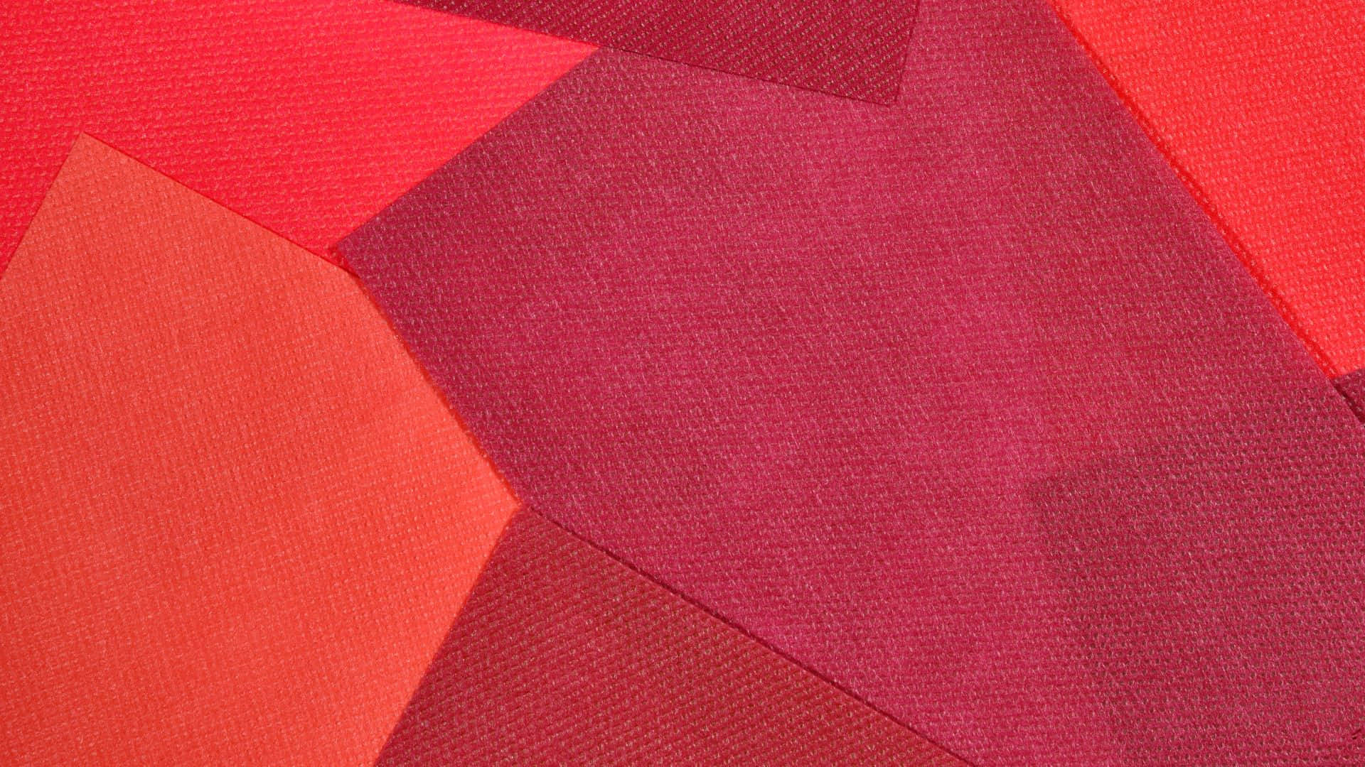 abstract red geometric shapes, textured fabric panels, varying shades of red, Full HD Desktop Wallpaper