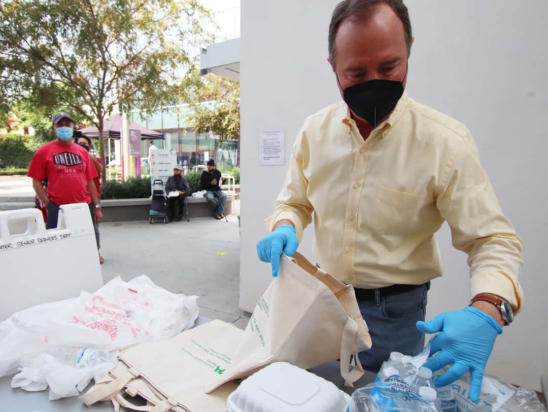 Adam Schiff, yellow shirt, blue gloves, SD Desktop Wallpaper
