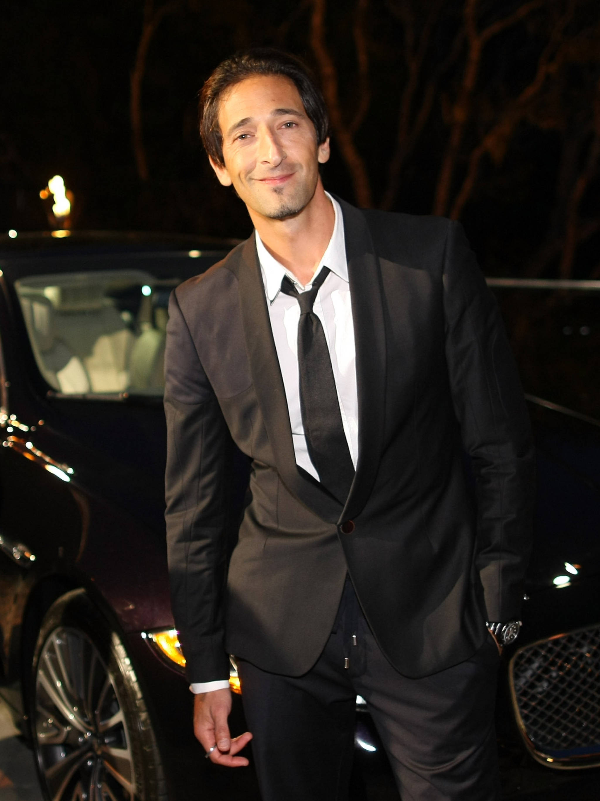 Adrien Brody, black suit, luxury car, 2K Phone Wallpaper