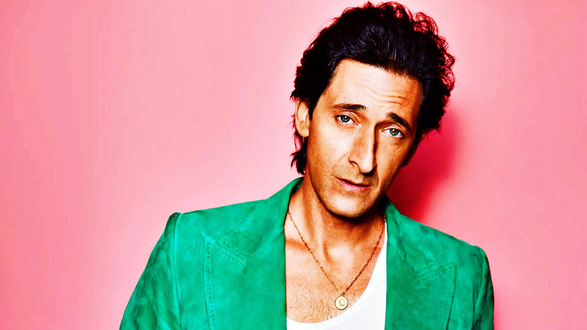 Adrien Brody, vibrant green jacket, solid pink background, Full HD Desktop Wallpaper