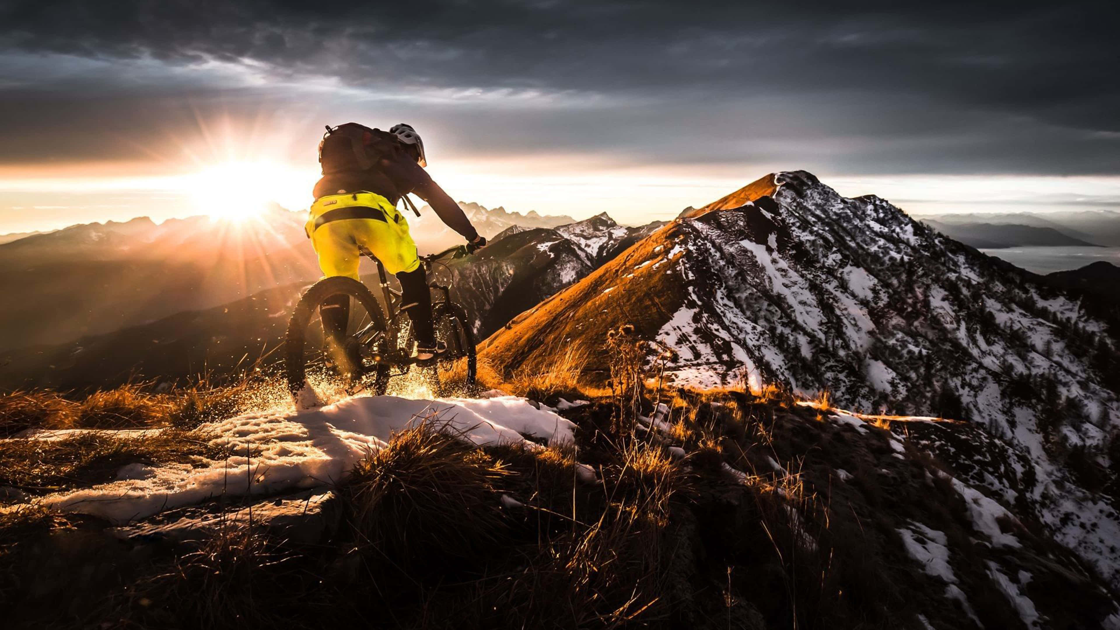 mountain biker, bright yellow gear, snow, 4K Desktop Wallpaper