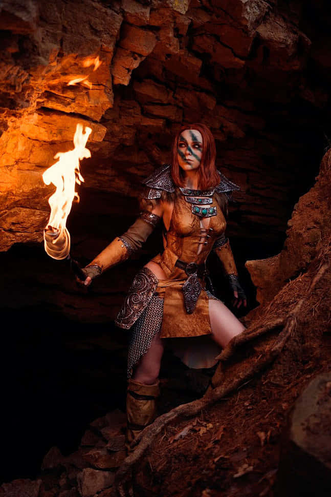 Aela The Huntress, blue face paint, flaming torch, SD Phone Wallpaper