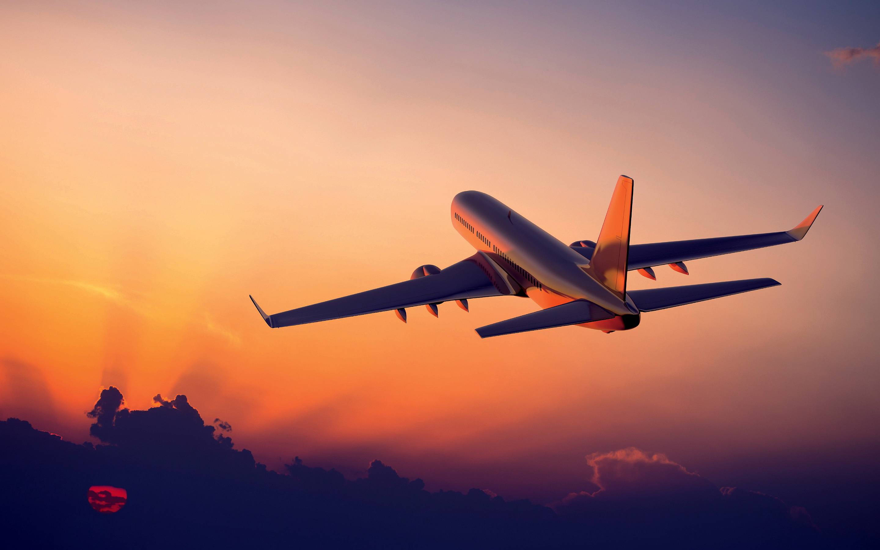 flying aeroplane, sunset, orange and purple clouds, 2K Desktop Wallpaper