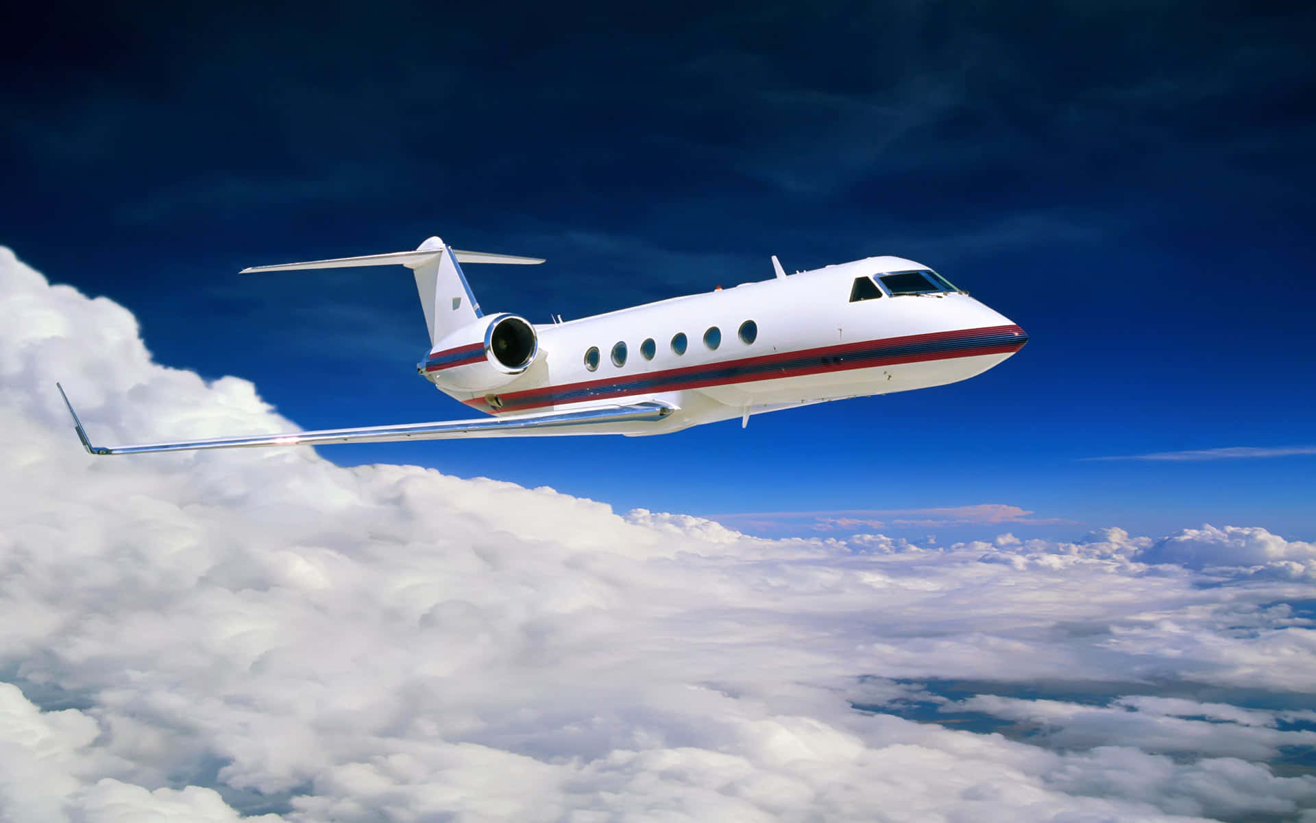 sleek white private jet, red stripes, fluffy white clouds, Full HD Desktop Wallpaper