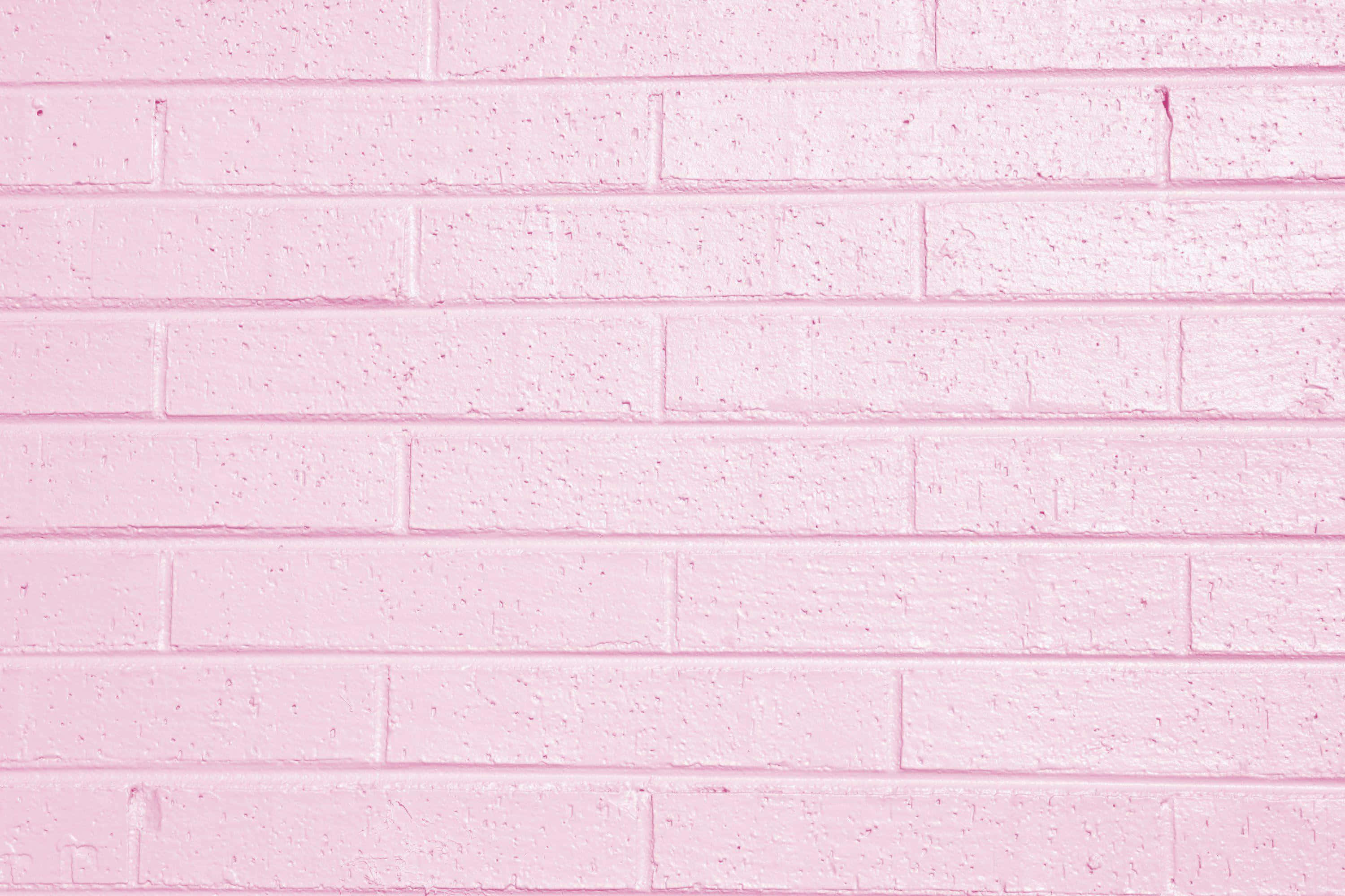 Aesthetic Baby Pink, smooth pink painted brick wall, visible mortar lines, 2K Desktop Wallpaper