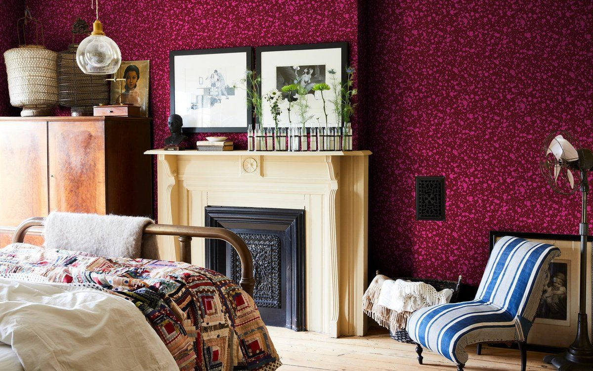 deep magenta floral wallpaper, cream fireplace, striped chair, SD Desktop Wallpaper