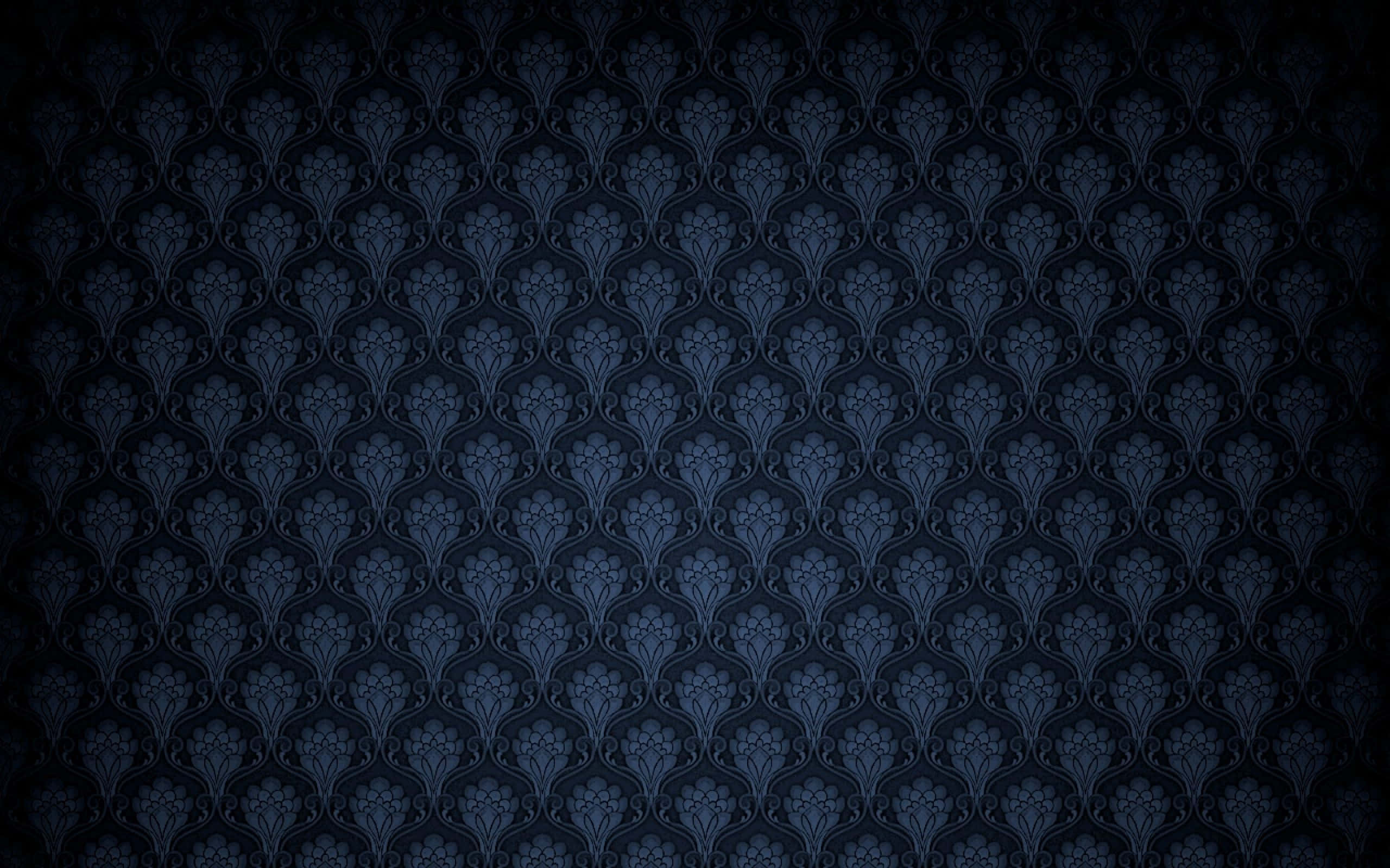 dark blue, repeating ornate floral damask pattern, fading to black edges, 2K Desktop Wallpaper