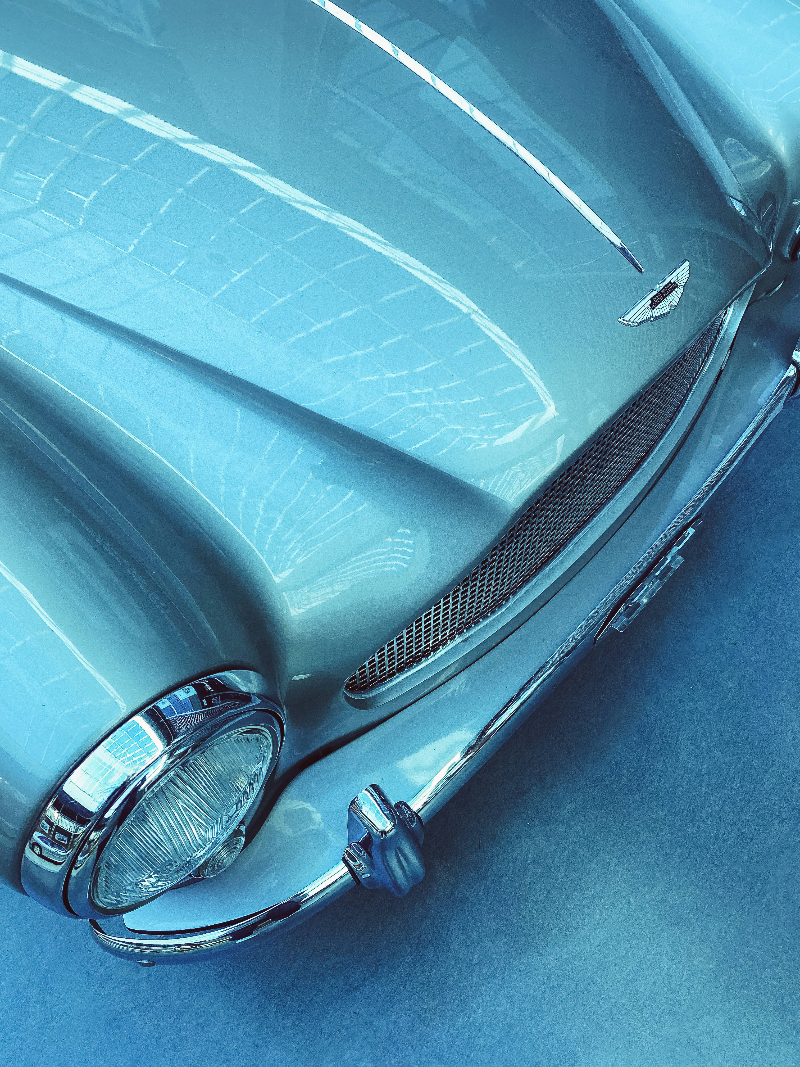 Aesthetic Blue iPhone, vintage car, gleaming hood, 4K Phone Wallpaper