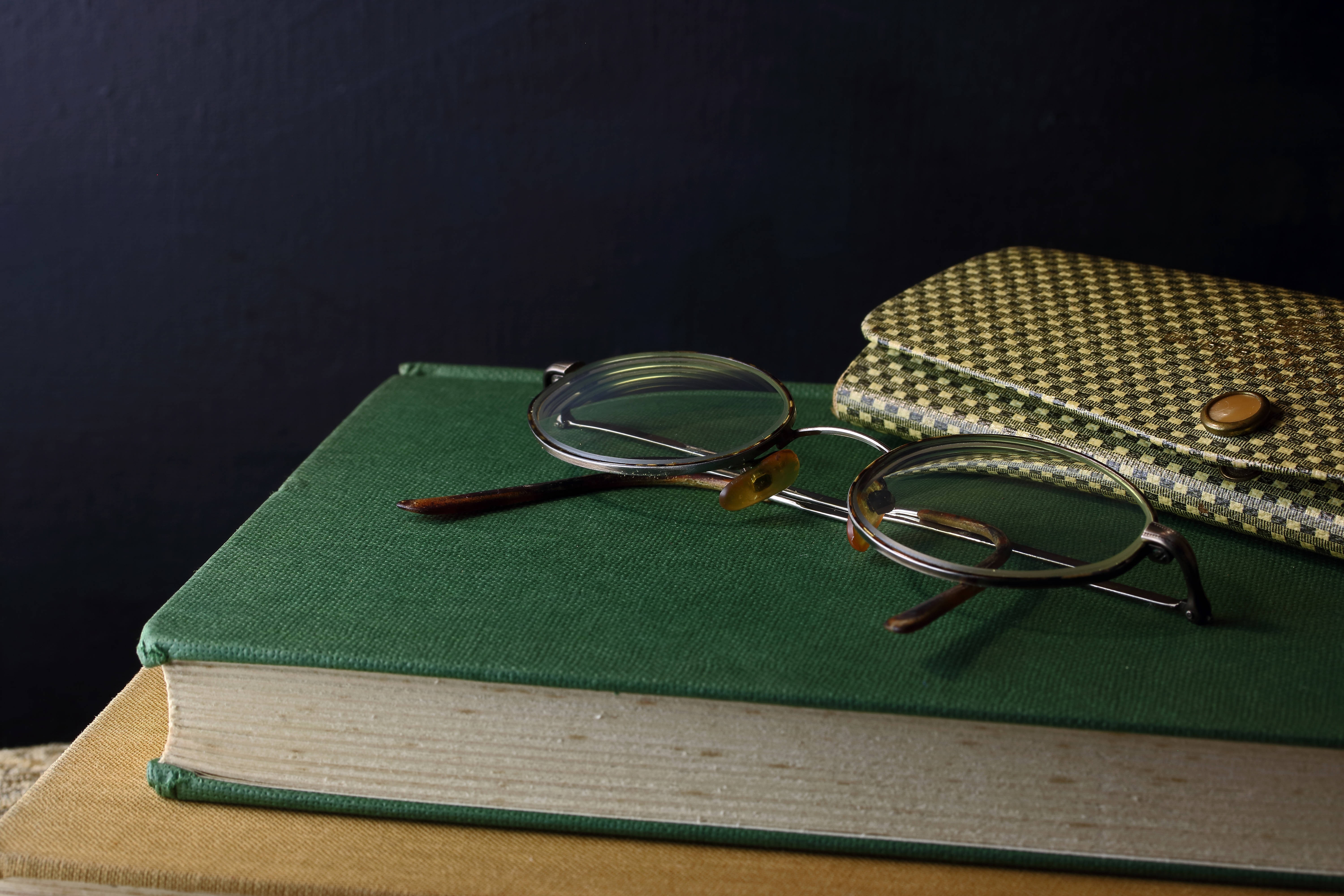 vintage round glasses, green book, patterned wallet, 5K Desktop Wallpaper