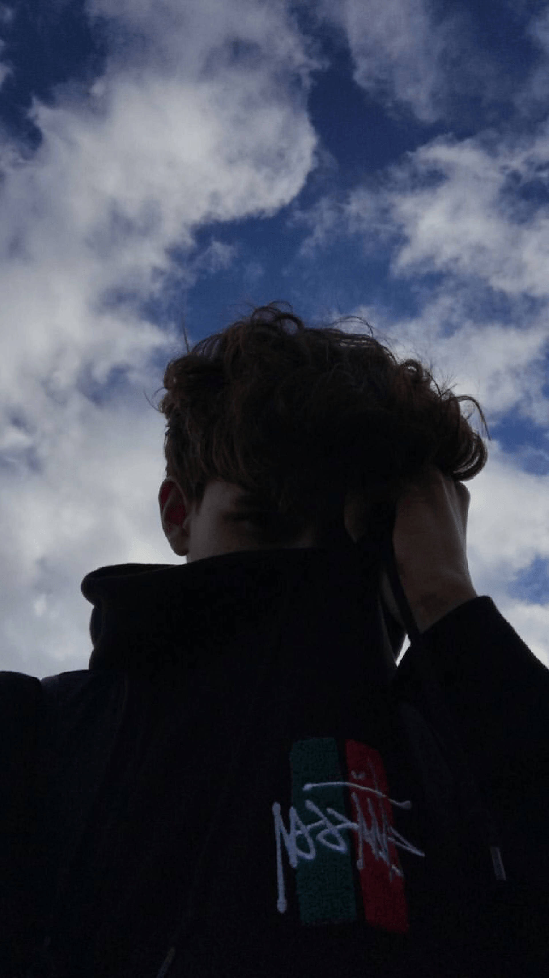 emo aesthetic boy, silhouette, dramatic cloudy sky, 2K Phone Wallpaper