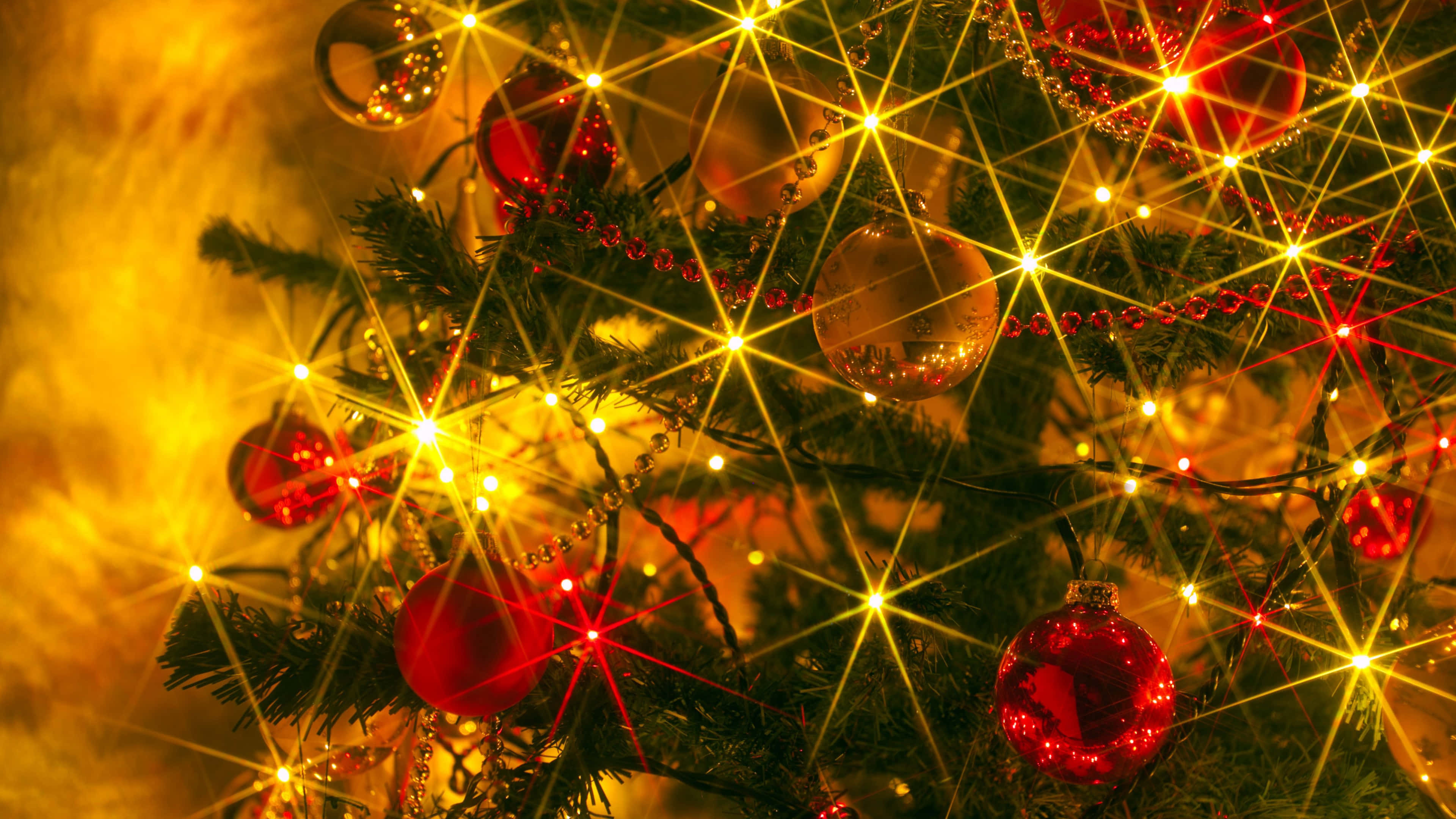 glowing golden lights, red ornaments, starburst effects, 4K Desktop Wallpaper