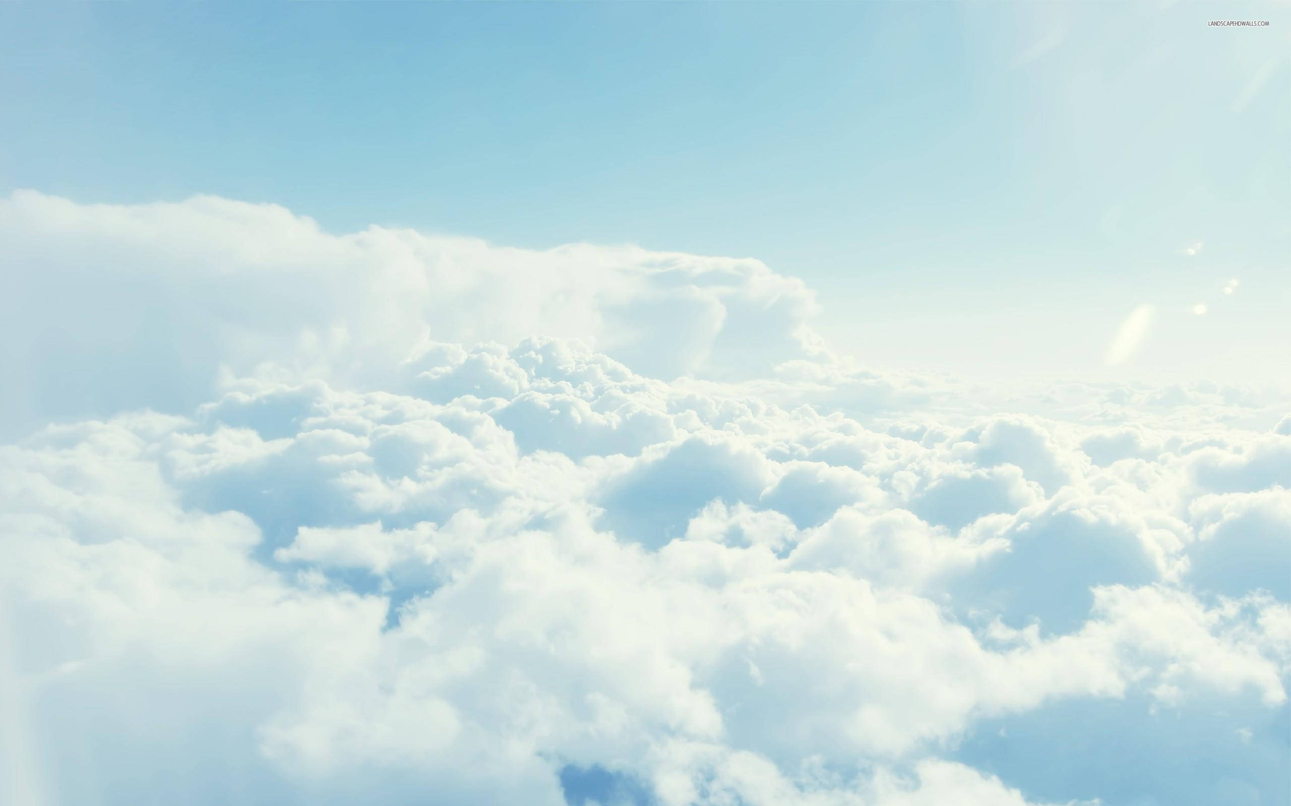 aerial view, fluffy white clouds, clear blue sky, 2K Desktop Wallpaper