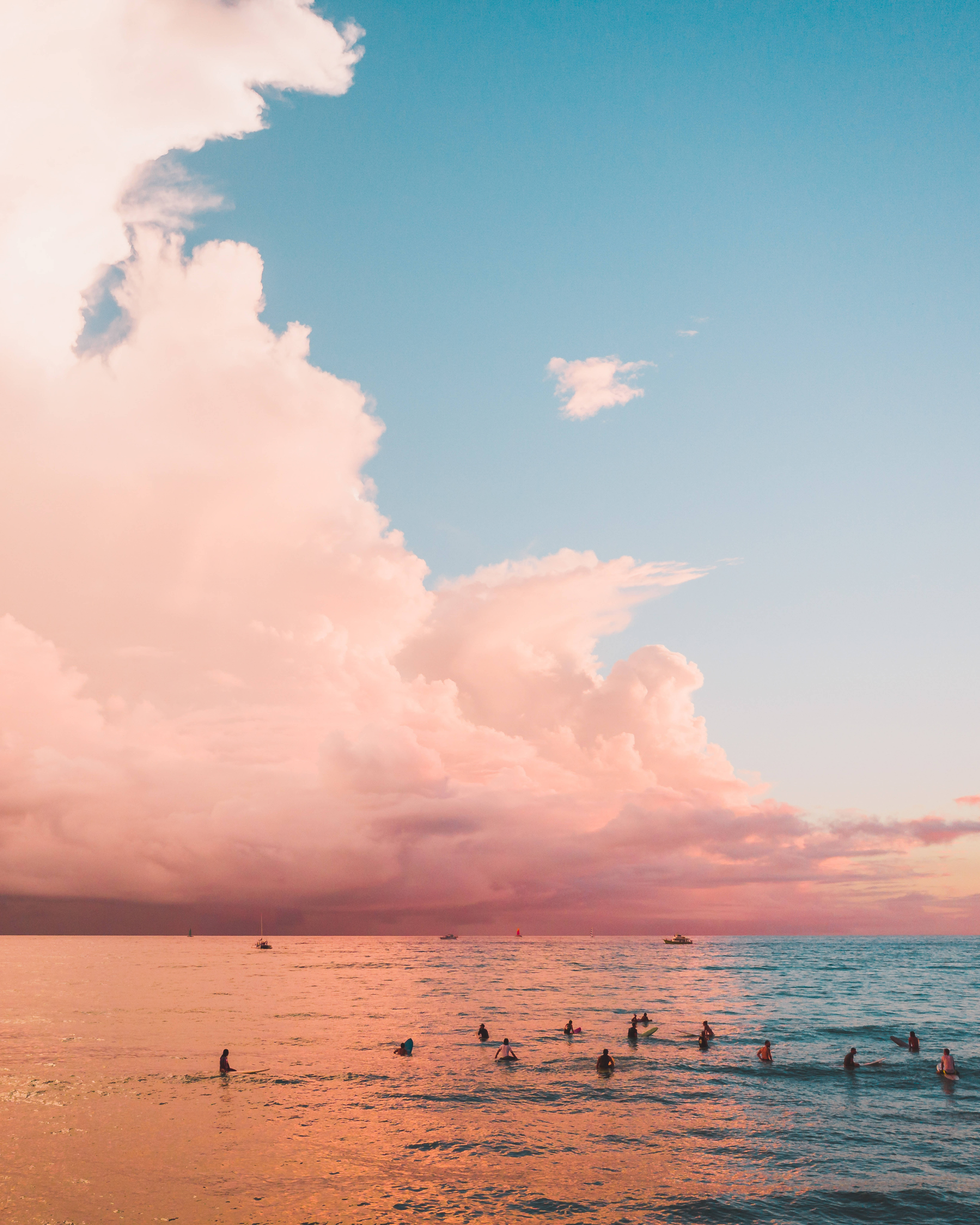 Sea Cloud iPhone, warm pink and orange waters, dramatic sunset sky, 8K Phone Wallpaper