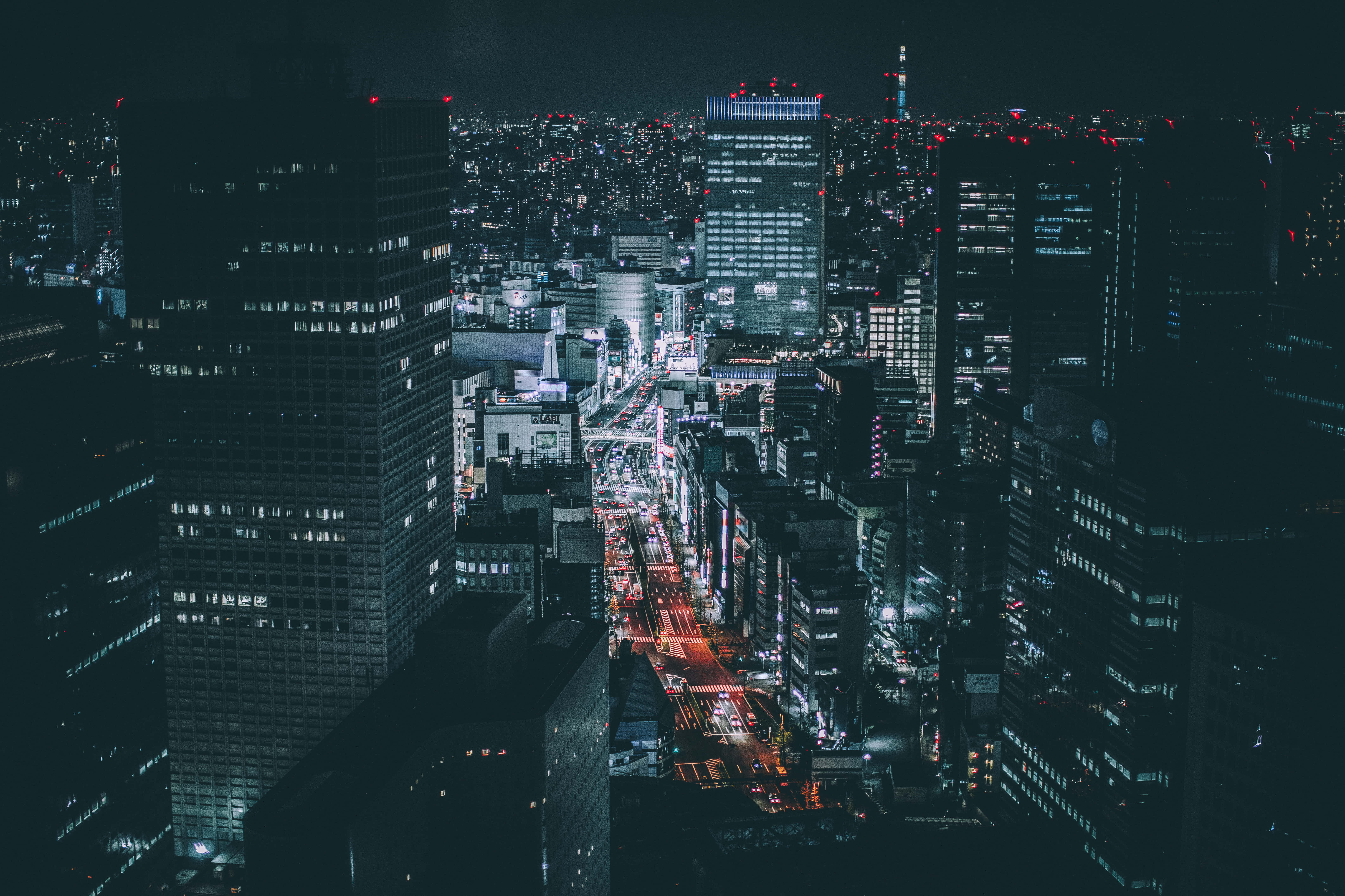 city at night, glowing skyscrapers, vibrant streetlights, 5K Desktop Wallpaper