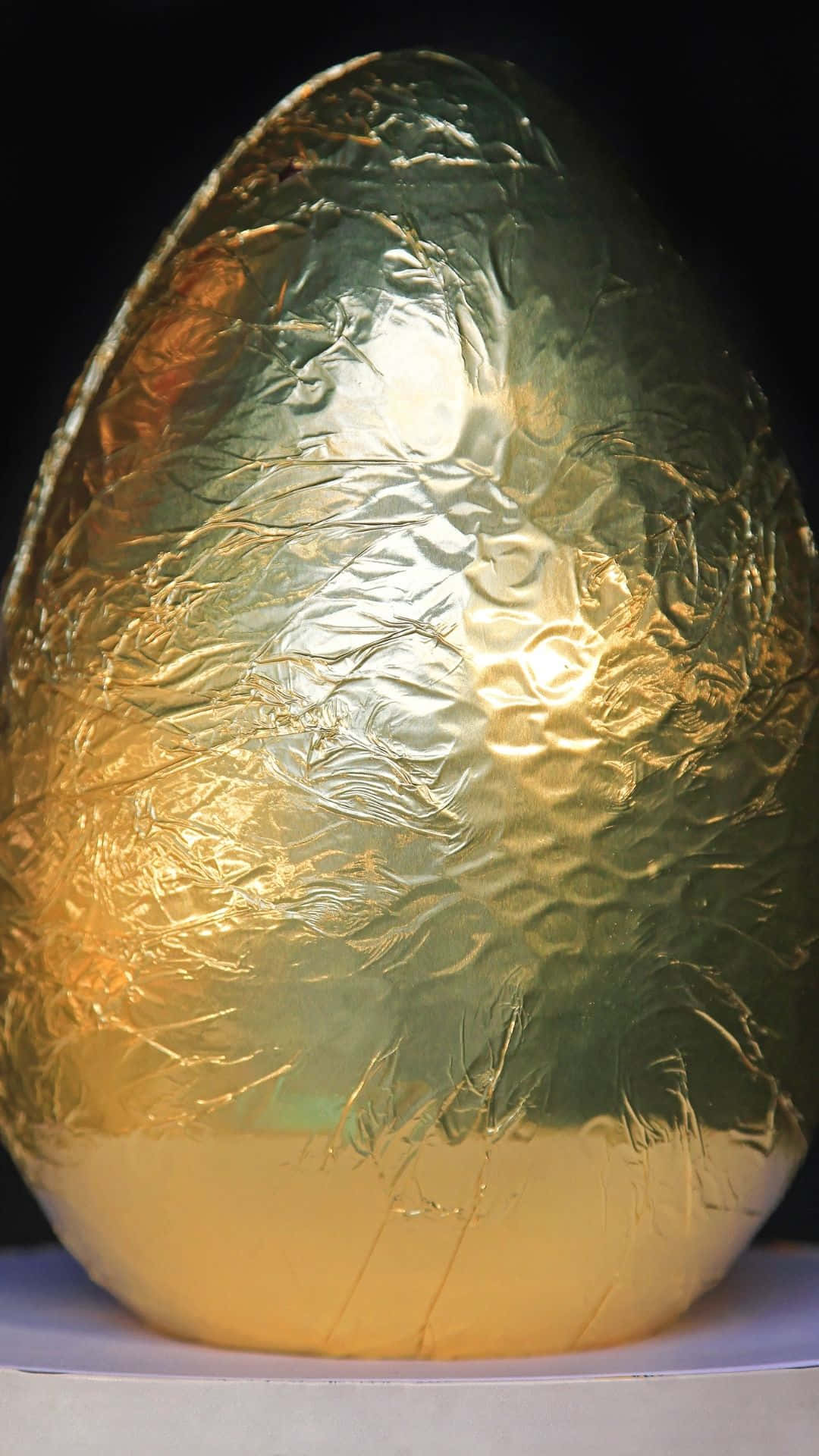 golden foil-wrapped egg, crinkled texture, warm highlights, Full HD Phone Wallpaper