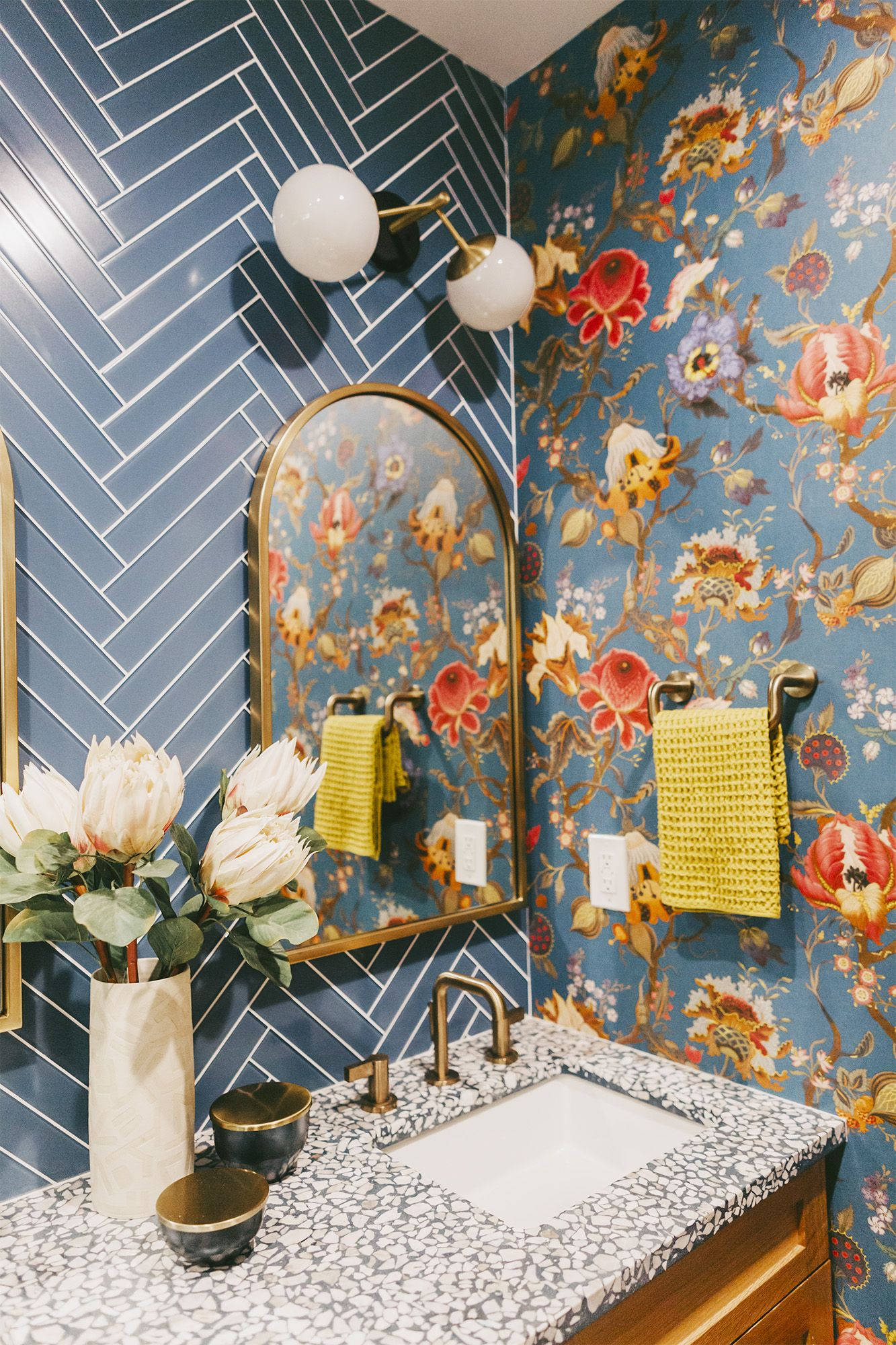 arc mirror, flower-patterned powder room, blue herringbone tile walls, Full HD Phone Wallpaper