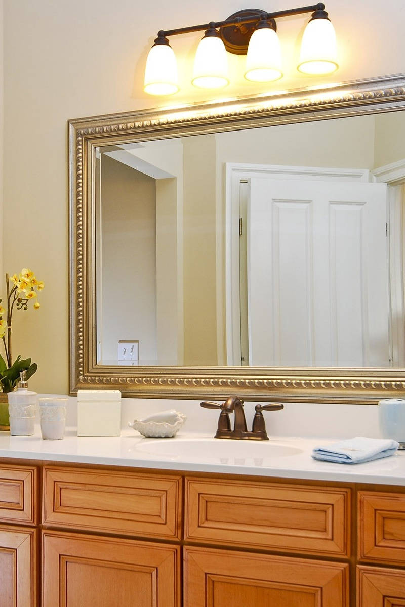 gold-framed mirror, wooden cabinets, white door, SD Phone Wallpaper