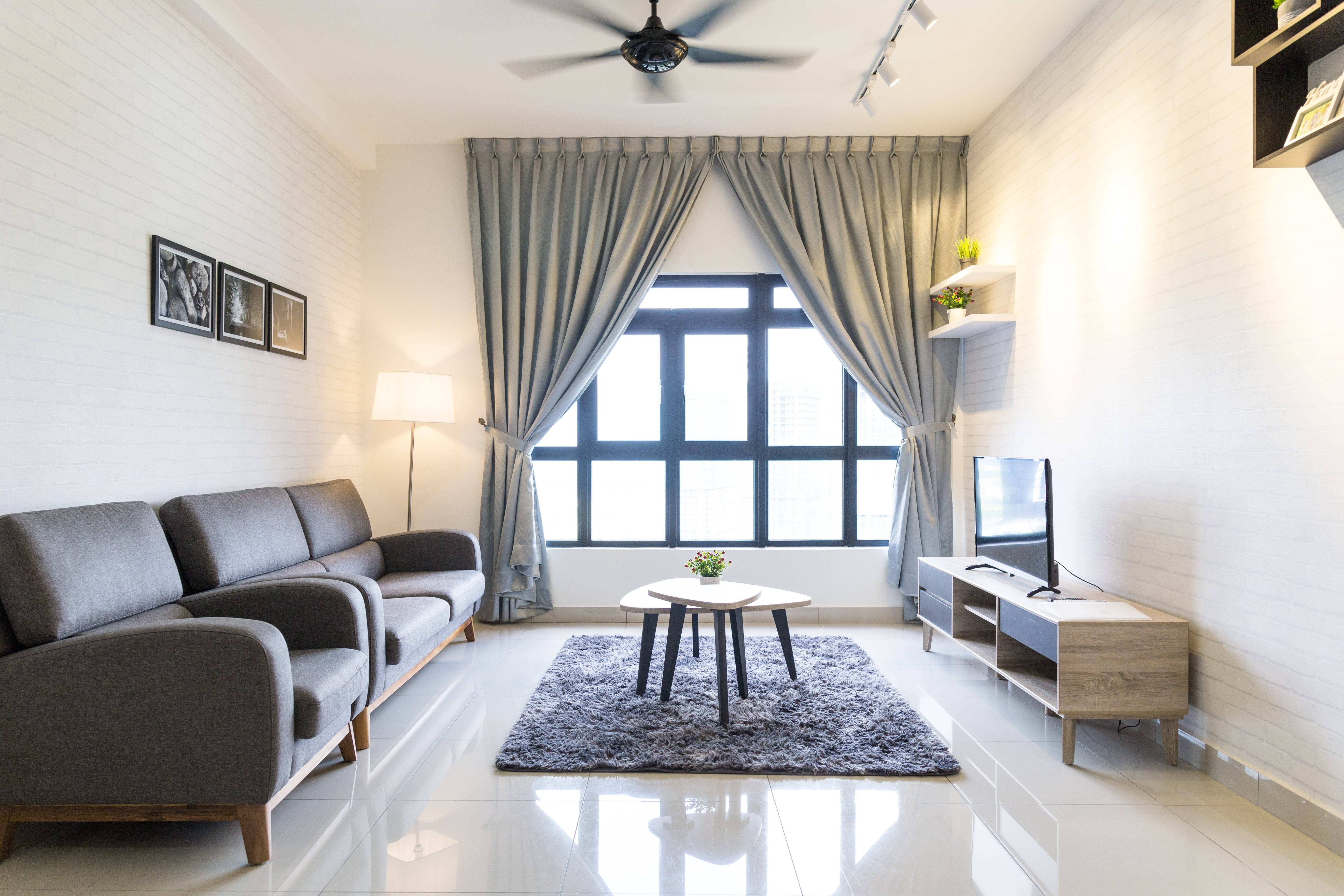white-themed living room, gray sofa, white brick walls, 5K Desktop Wallpaper