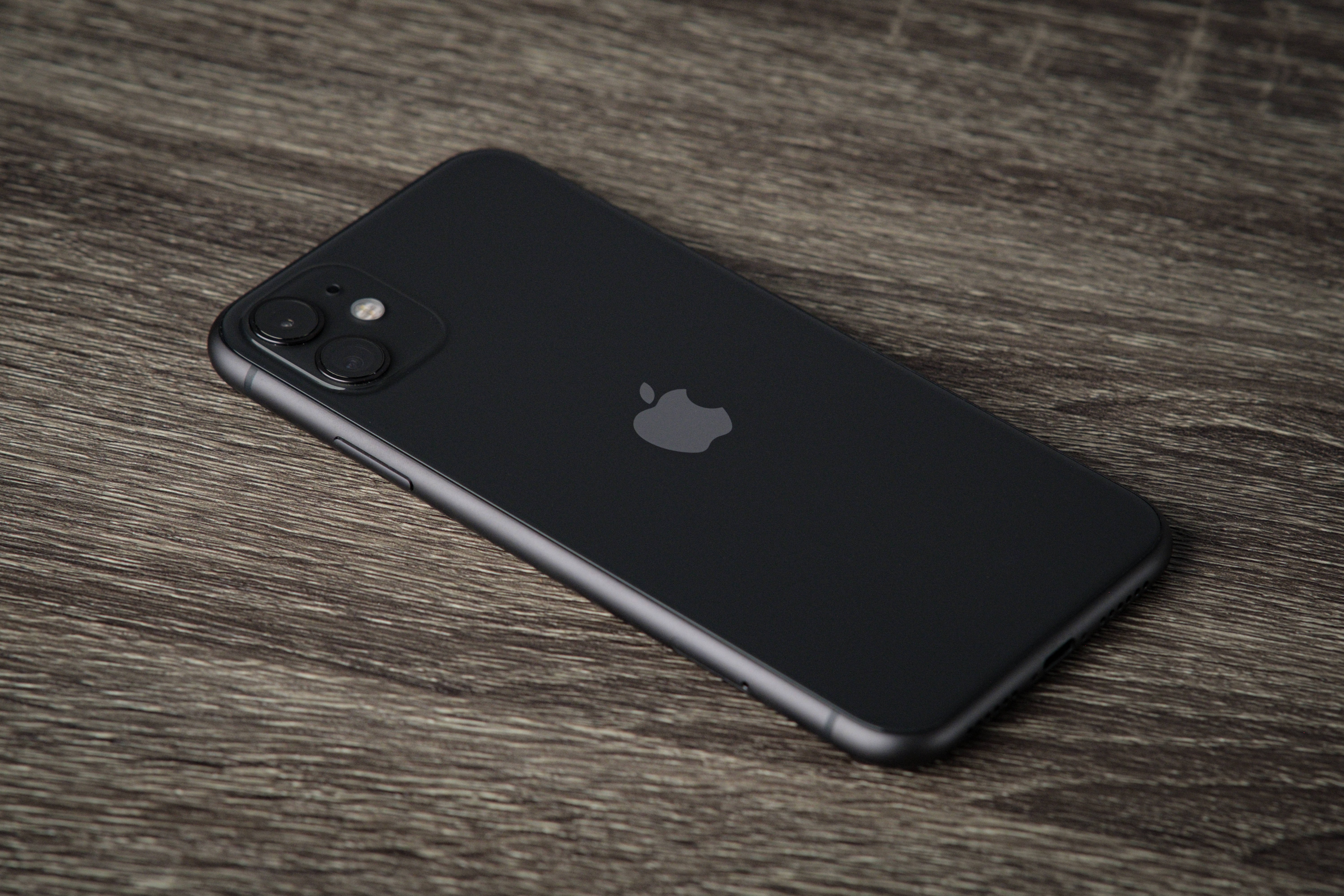 iPhone 11, black, textured gray wooden surface, 5K Desktop Wallpaper