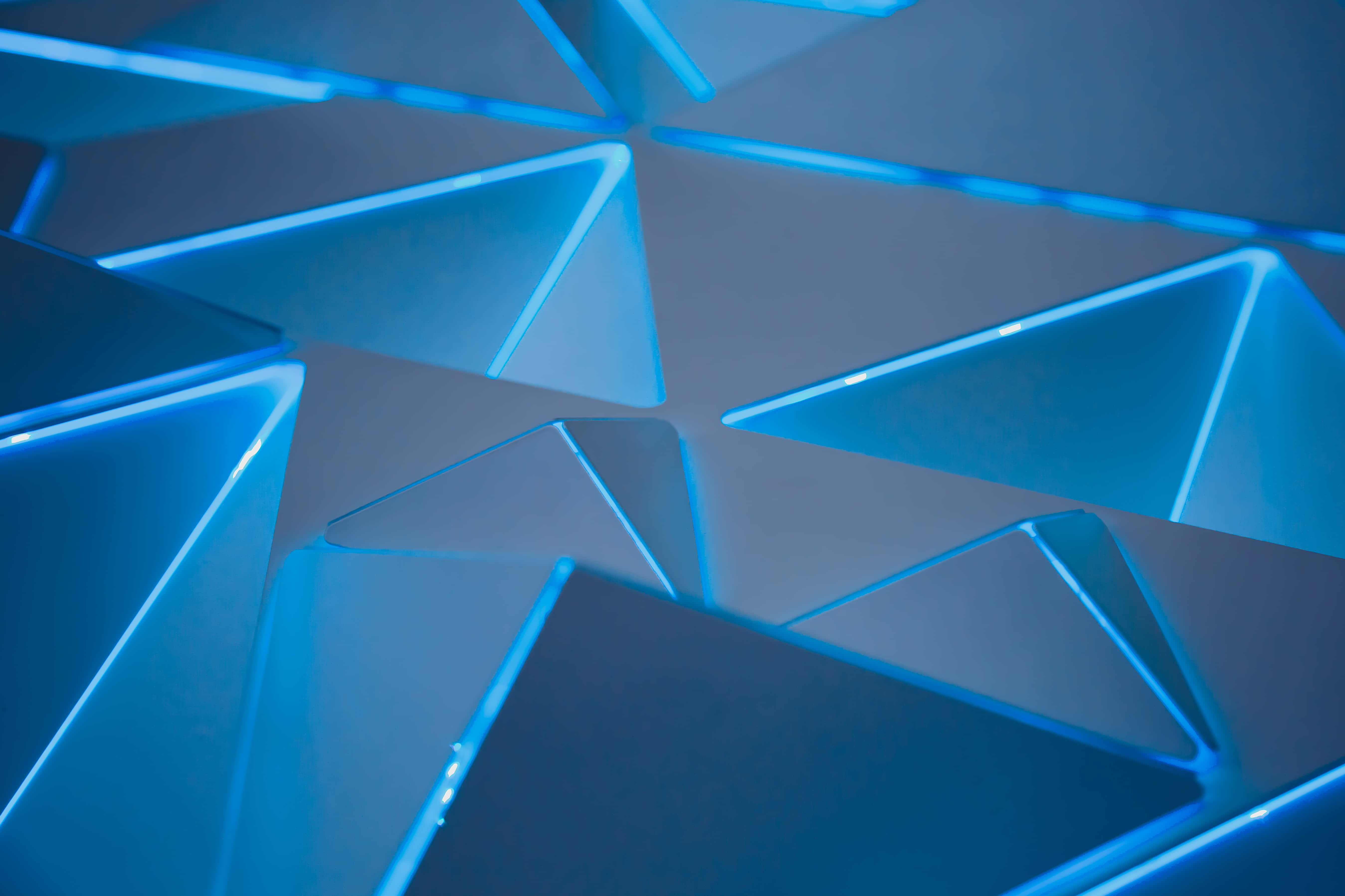 blue geometric pattern, glowing blue triangular panels, futuristic geometric pattern, 5K Desktop Wallpaper