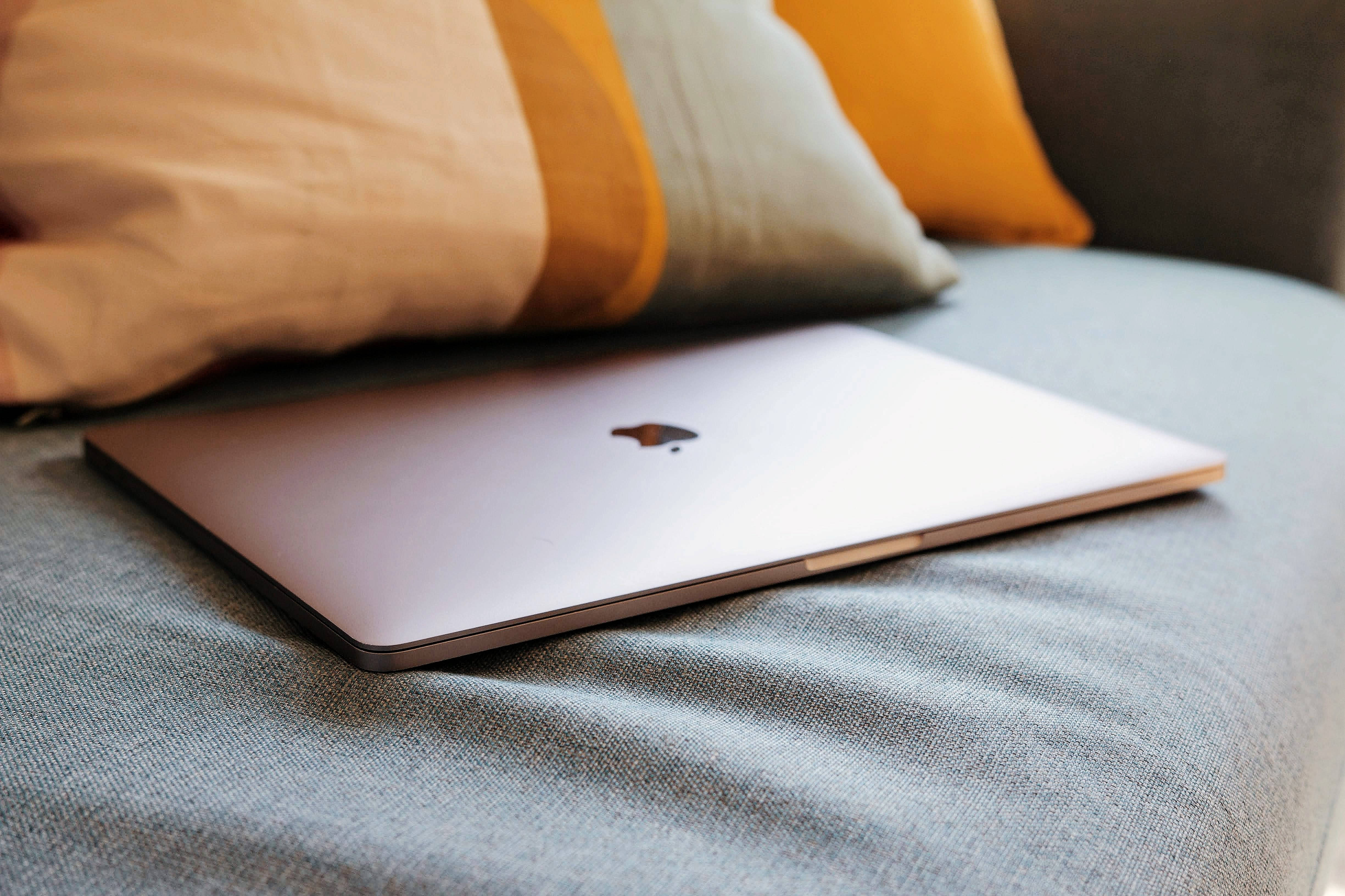 Aesthetic Mac, silver laptop, textured gray couch cushion, 4K Desktop Wallpaper