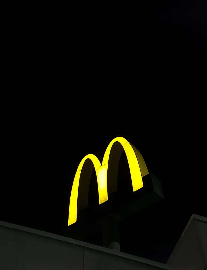 McDonalds, glowing yellow McDonald's arch logo, pitch black night sky, SD Phone Wallpaper
