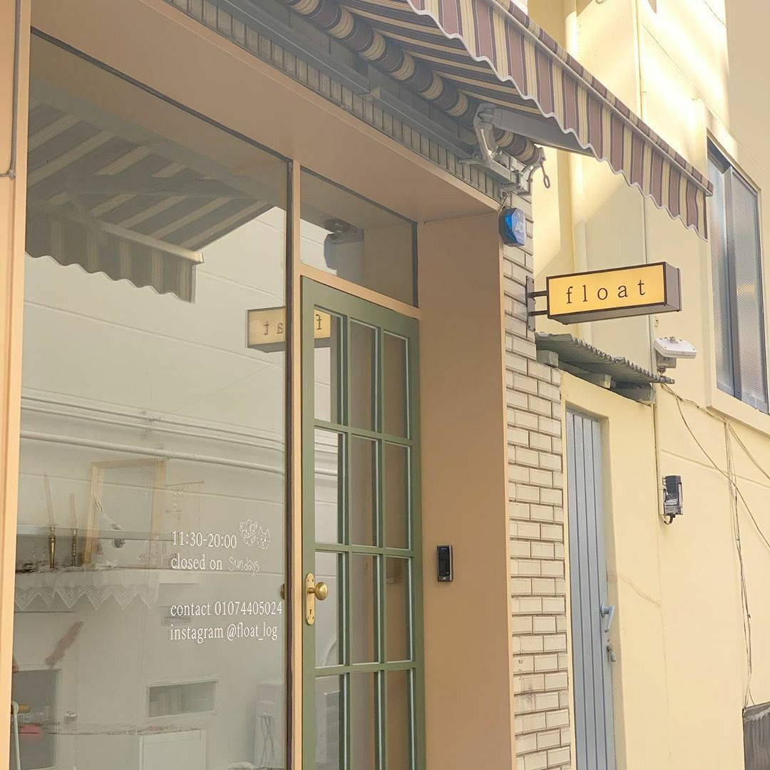 beige korean store exterior, striped awning, green-framed glass door, SD Desktop Wallpaper