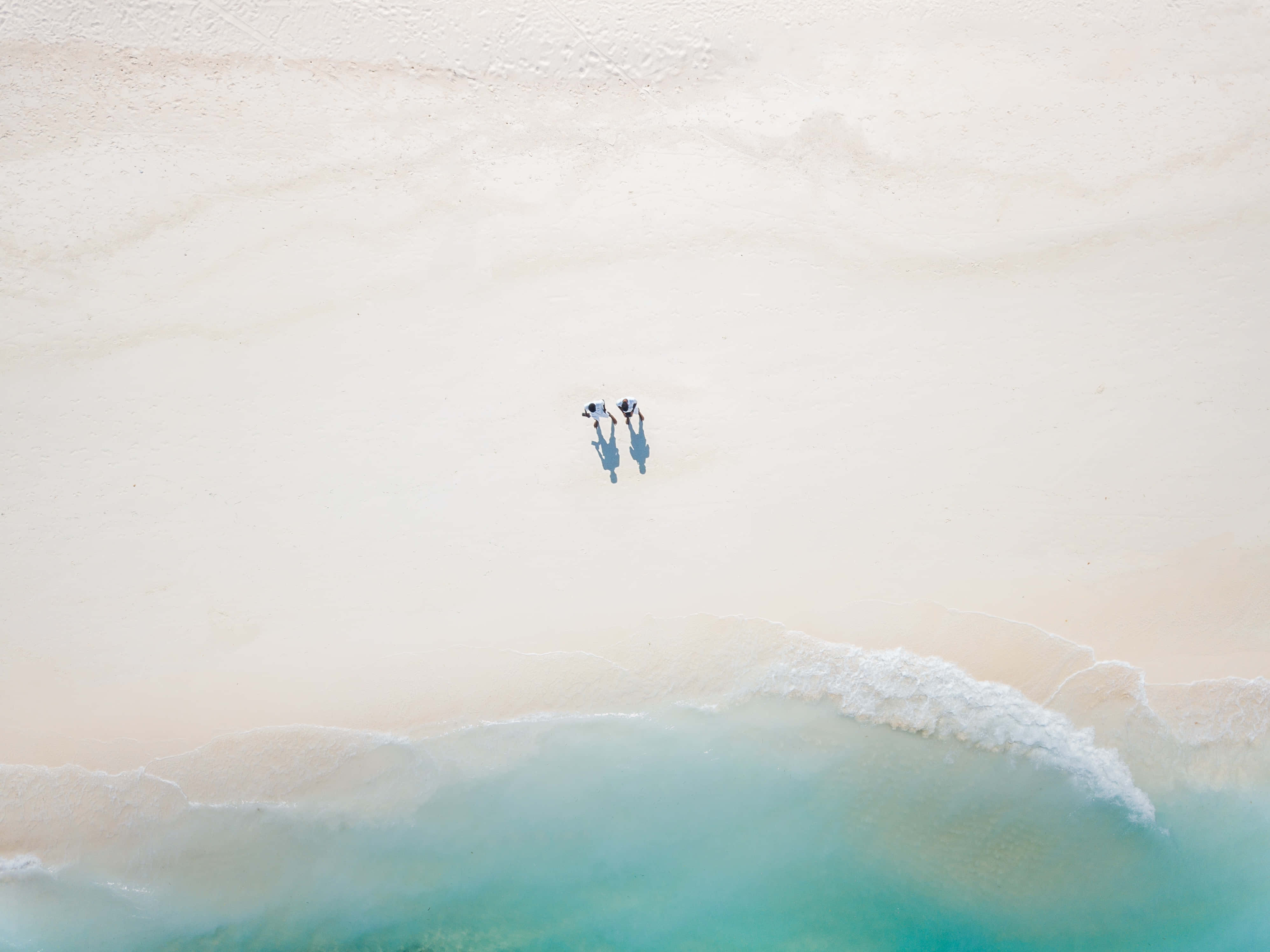 pristine white sand beach, turquoise waves, gently lap the shore, 4K Desktop Wallpaper