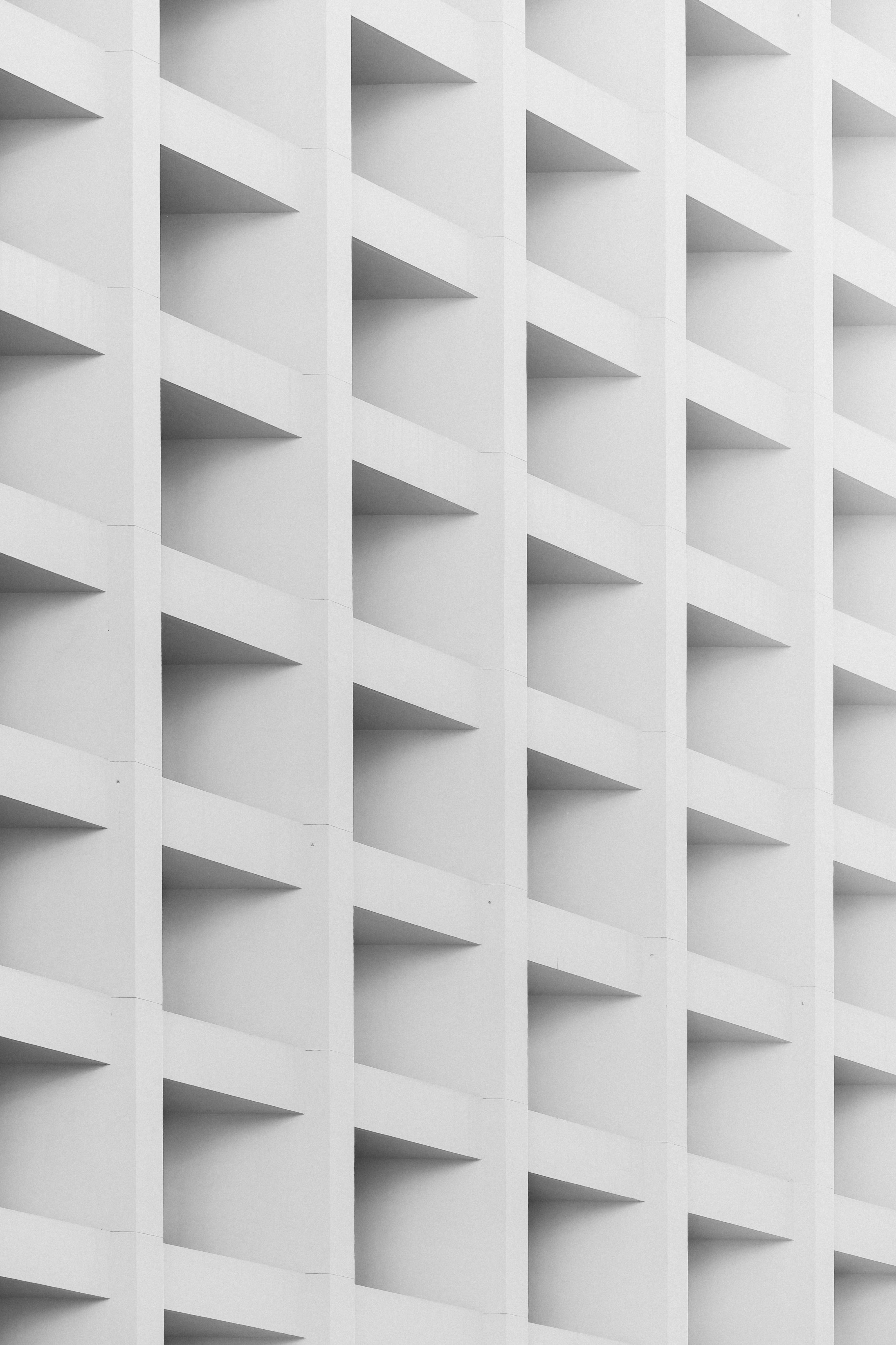 abstract white square pattern, white modern building facade, repeating geometric recessed panels, 5K Phone Wallpaper