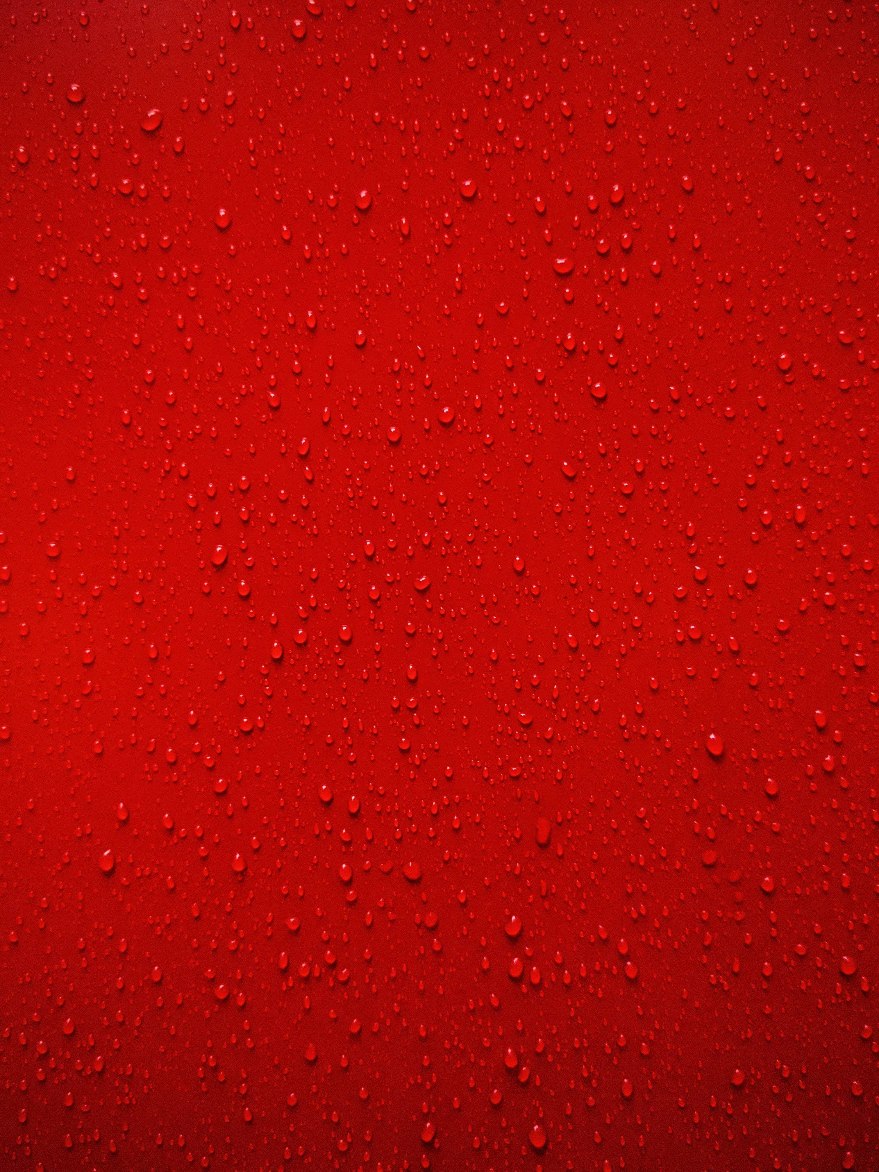 red raindrops, vivid red, glistening water droplets, 4K Phone Wallpaper