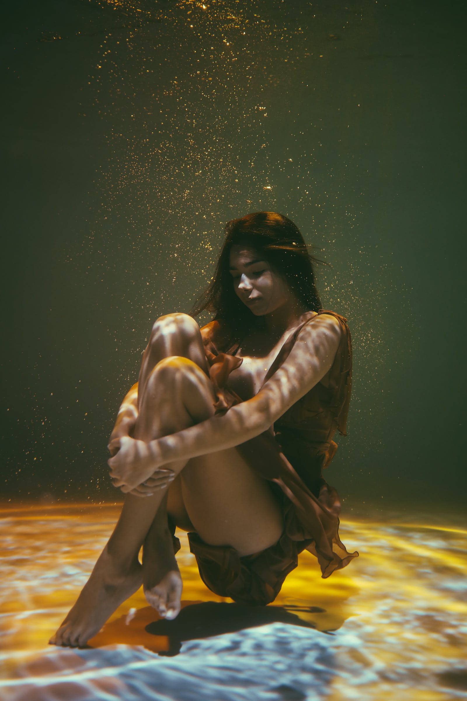 woman, underwater, golden light, Full HD Phone Wallpaper