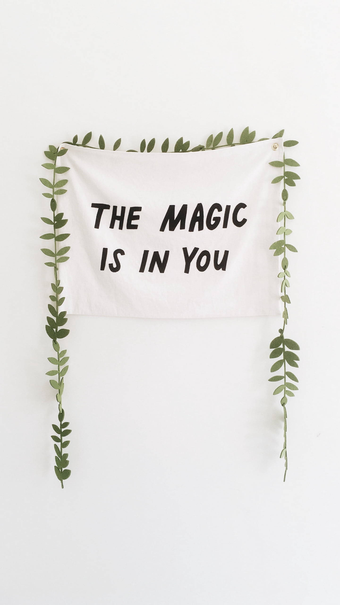 white wall hanging, bold black text, THE MAGIC IS IN YOU, 2K Phone Wallpaper