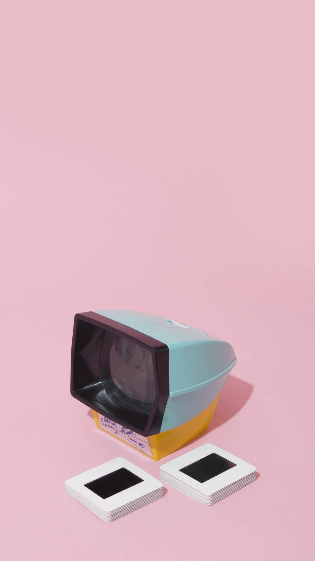 vintage slide projector, teal and yellow accents, soft pink background, Full HD Phone Wallpaper