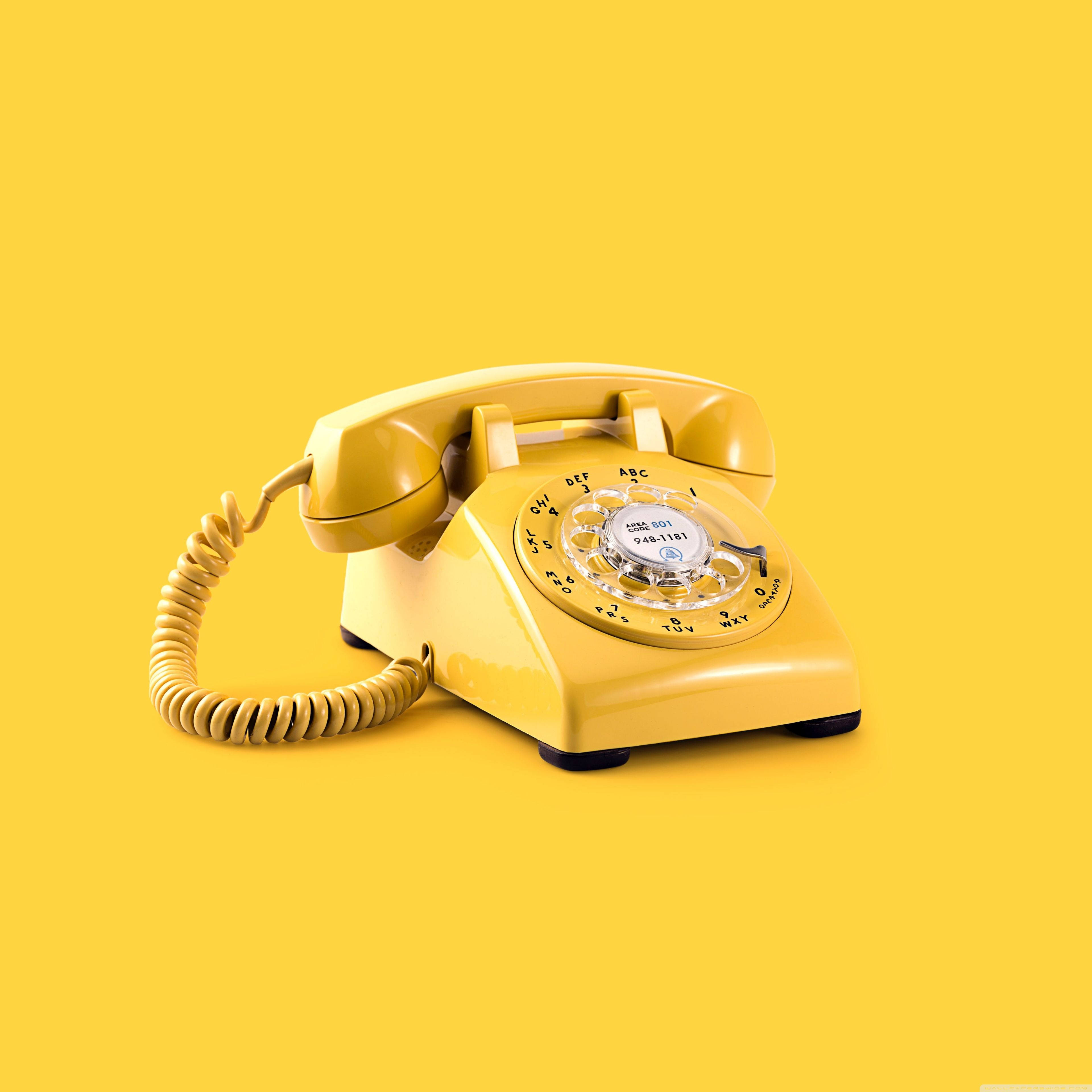 vintage yellow rotary telephone, solid yellow background, soft shadows, 4K Desktop Wallpaper