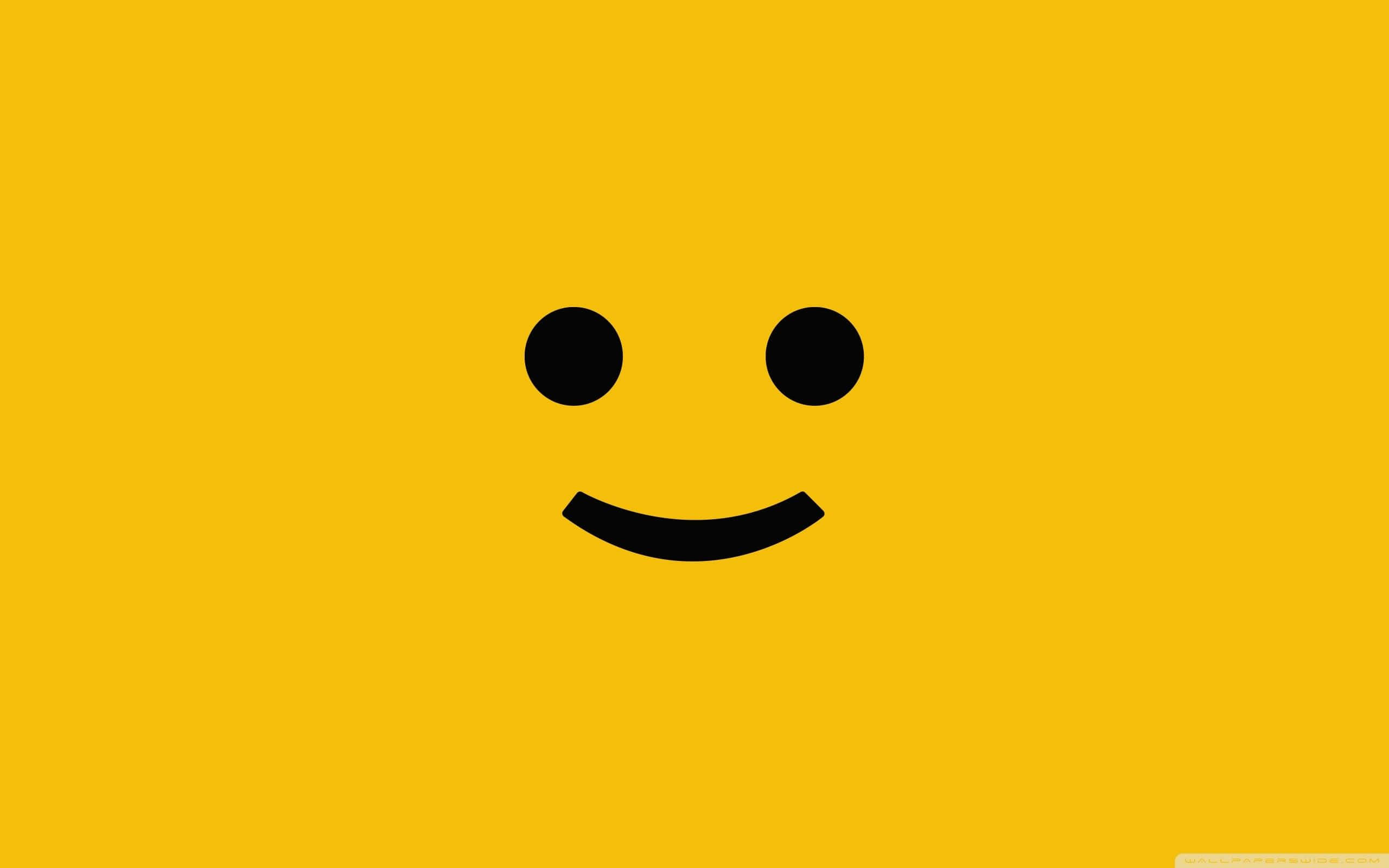 Aesthetic Smiley Face, minimalist black smiley face, solid bright yellow background, 2K Desktop Wallpaper