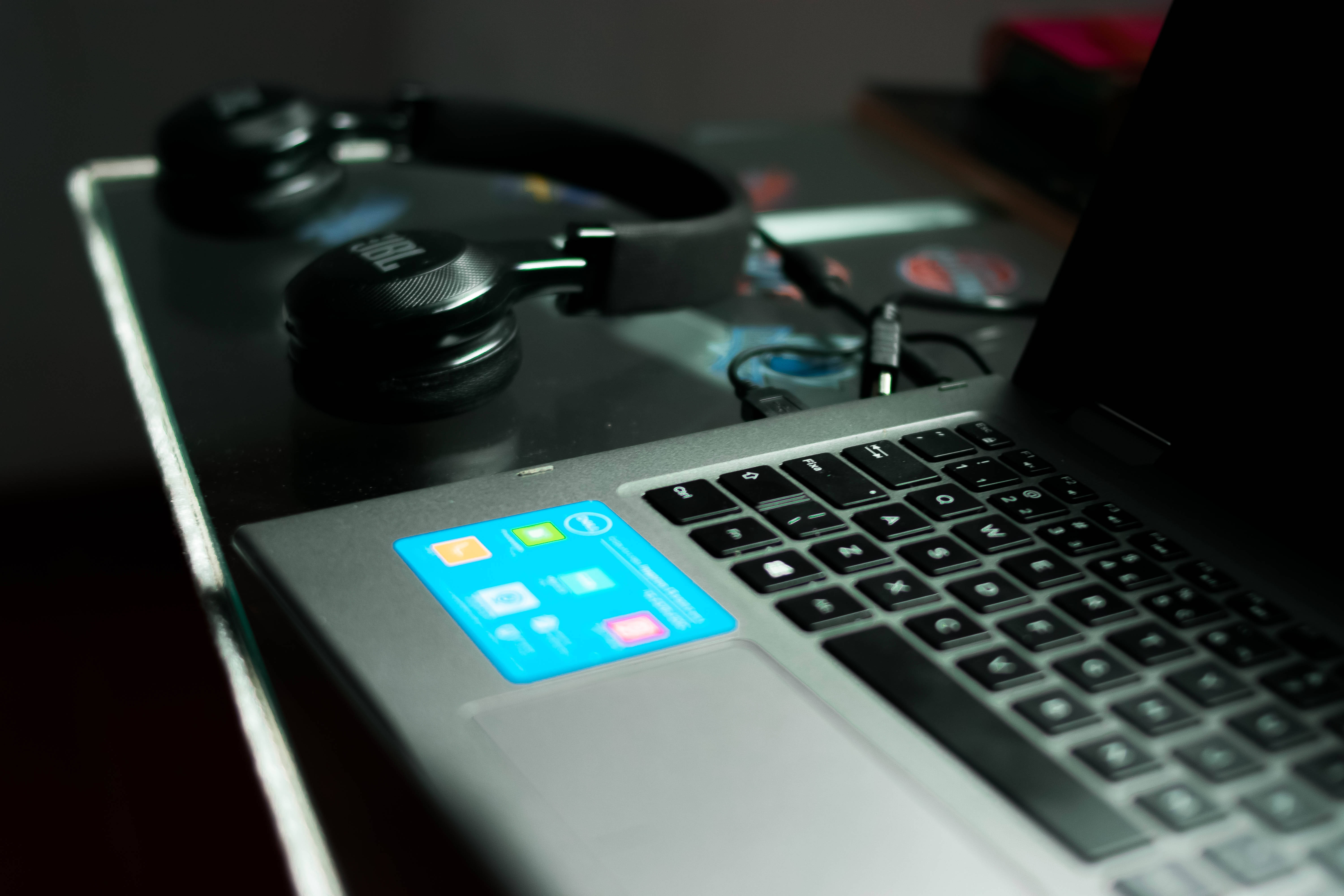 Aesthetic Tumblr Laptop, glowing blue app icons, black headphones, 5K Desktop Wallpaper