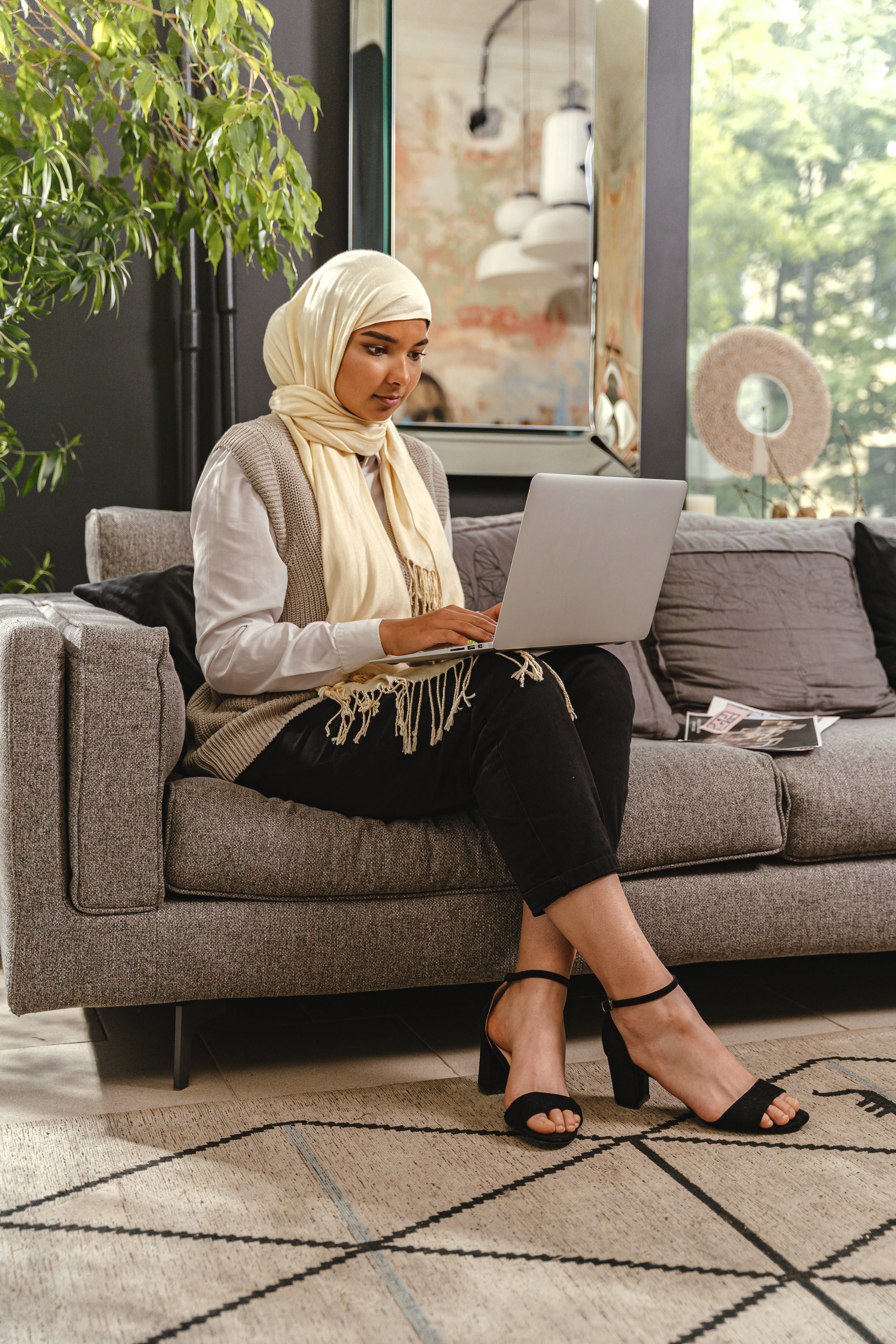 cream hijab, gray sofa, modern living room, 5K Phone Wallpaper